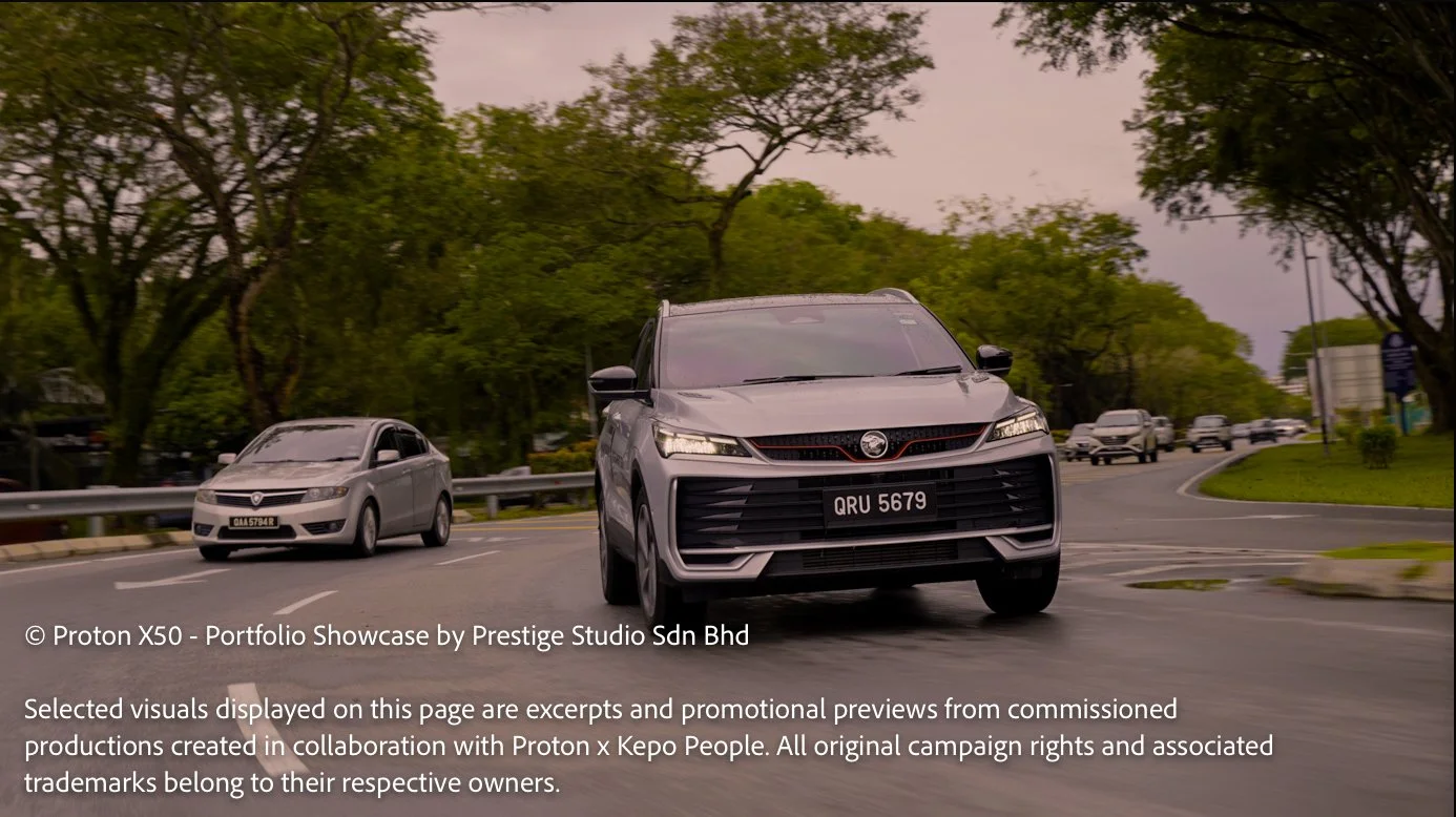 Proton X50 driving through tree-lined roads in Kuching during commercial filming