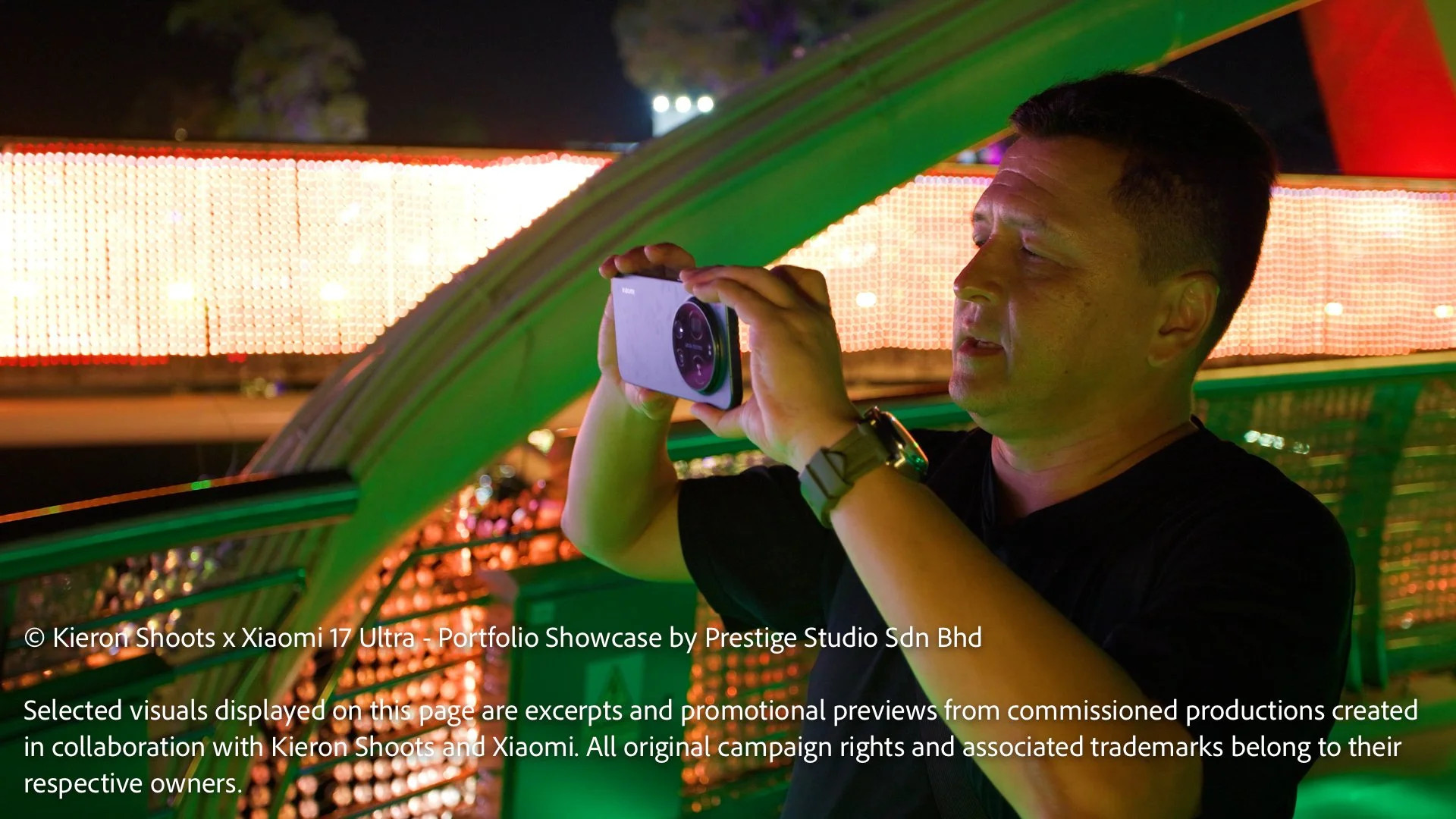 Leica photographer Kieron Long using the Xiaomi 17 Ultra for night photography at Kuching Waterfront in Sarawak.