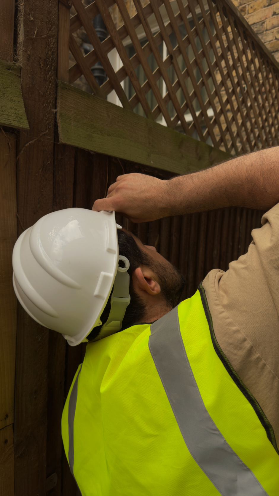 Irakli, founder of Arcade London Group, inspecting timber construction during a London residential renovation.