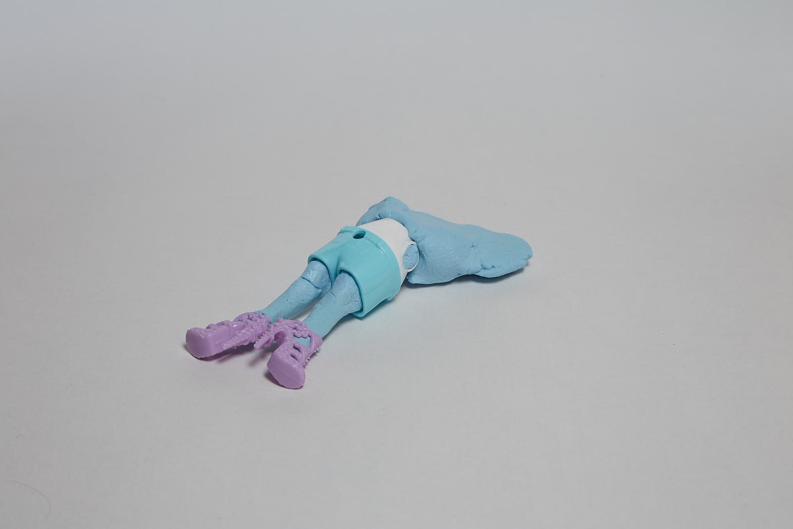 'After Lotta Volkova' from "Under the weight of societal expectations" series, 2021. Soft polymer clay and dolls accessories - 12 x 6 x 2 cm