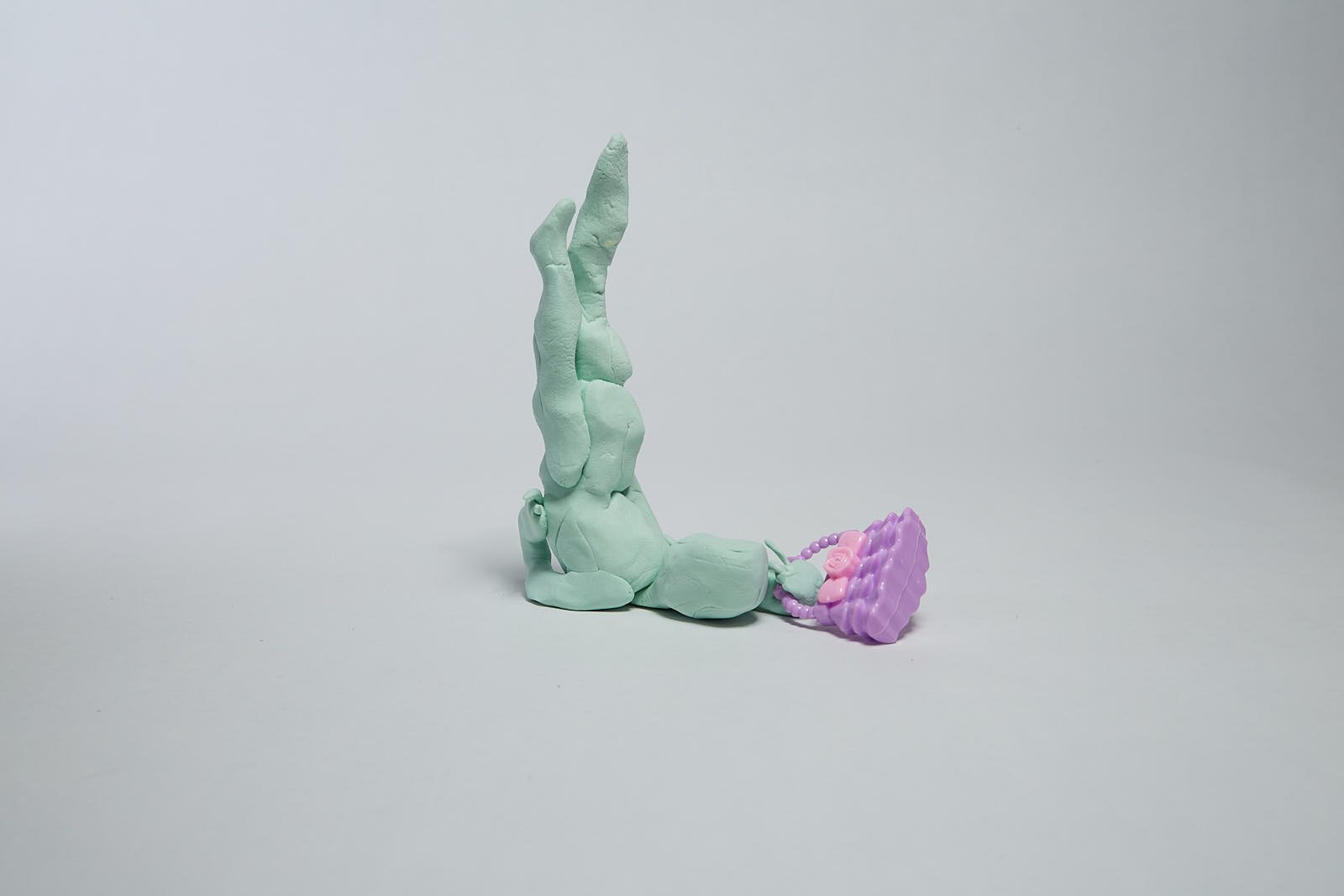 'Getting that bag (2)' from "Under the weight of societal expectations" series, 2021. Soft polymer clay and dolls accessories - 13 x 13 x 6 cm