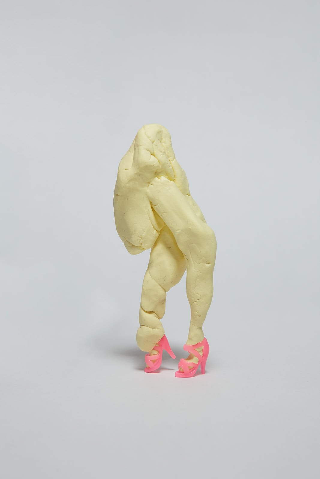 'Chicken legs' from "Under the weight of societal expectations" series, 2021. Soft polymer clay and dolls accessories - 13 x 5 x 3 cm