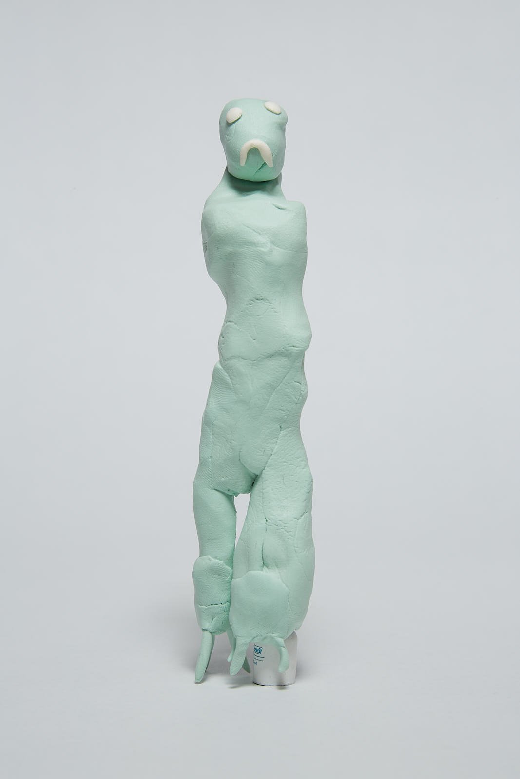 'Woman' from "Under the weight of societal expectations" series, 2021. Soft polymer clay and dolls accessories - 16 x 4 x 2 cm