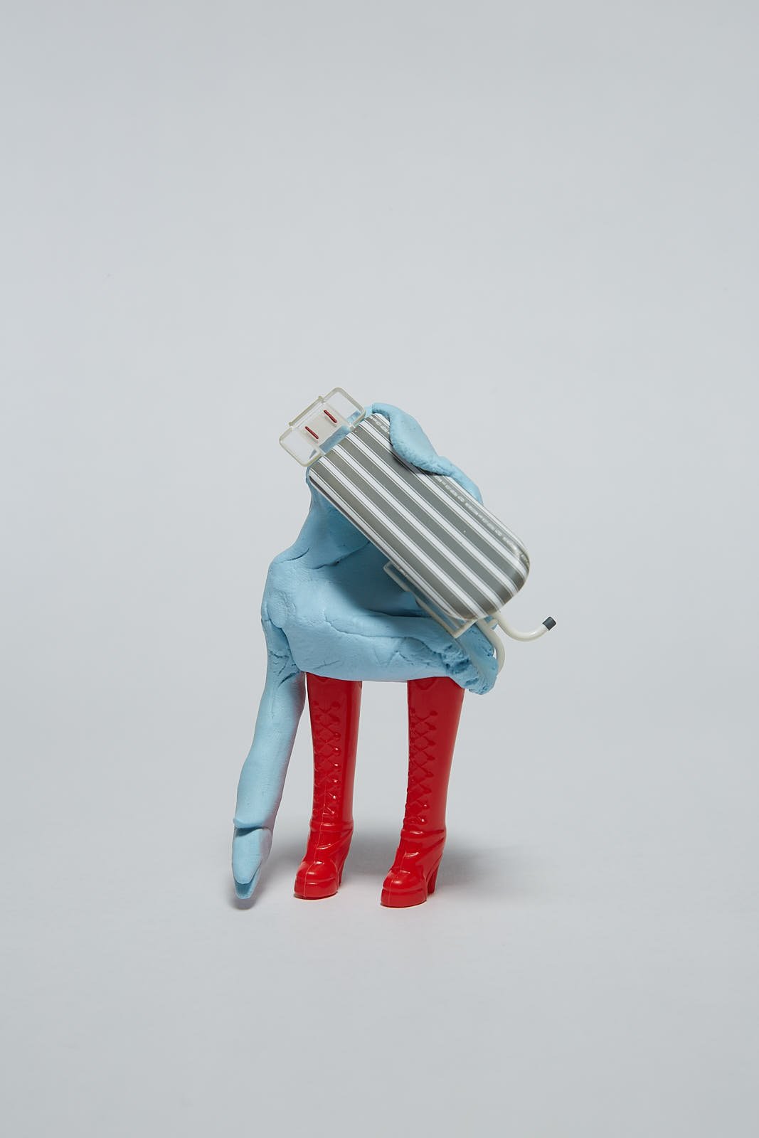 'Chores' from "Under the weight of societal expectations" series, 2021. Soft polymer clay and dolls accessories - 7 x 5 x 11 cm