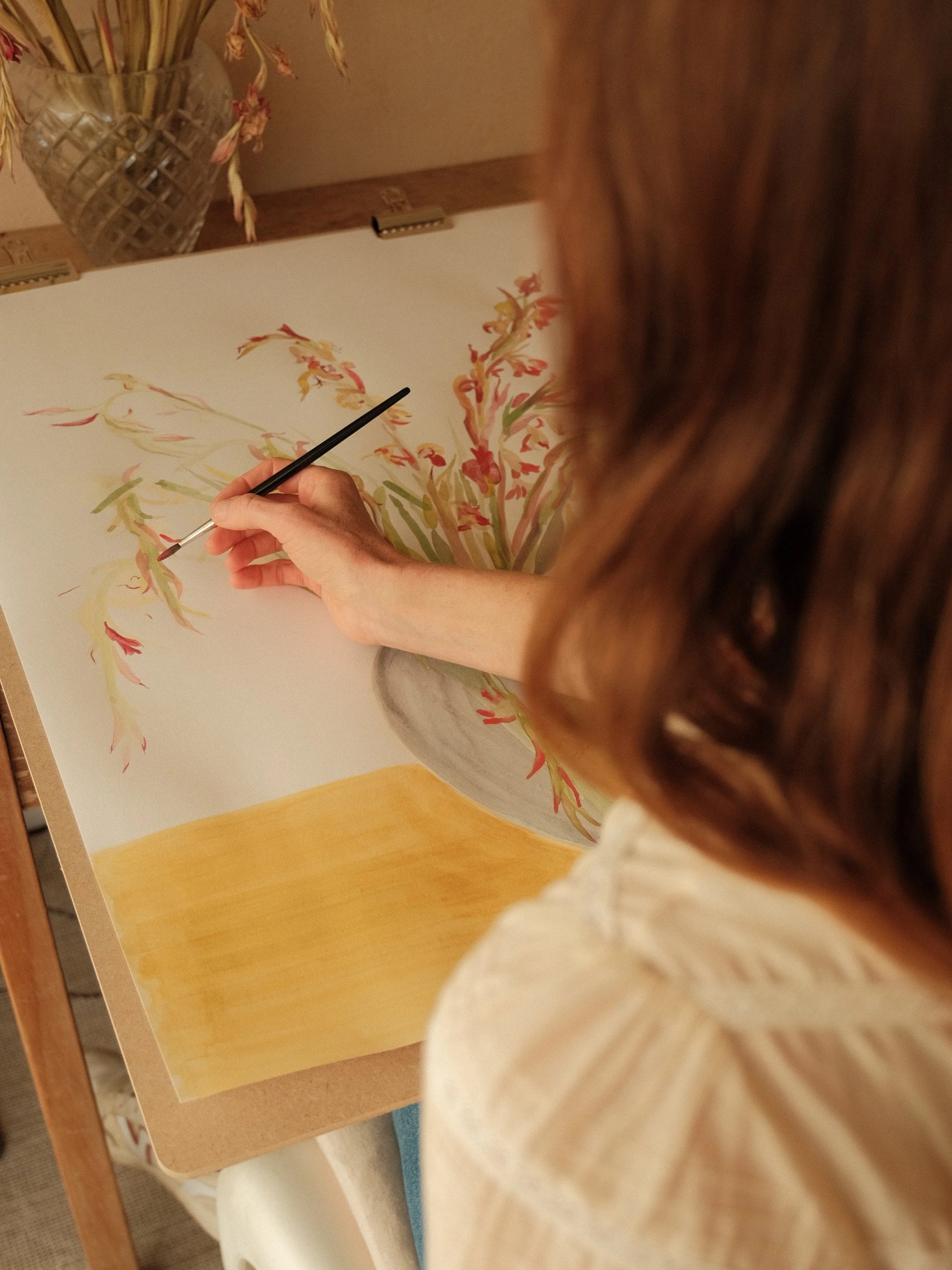 Lucy Wayne Painting Flowers.jpeg