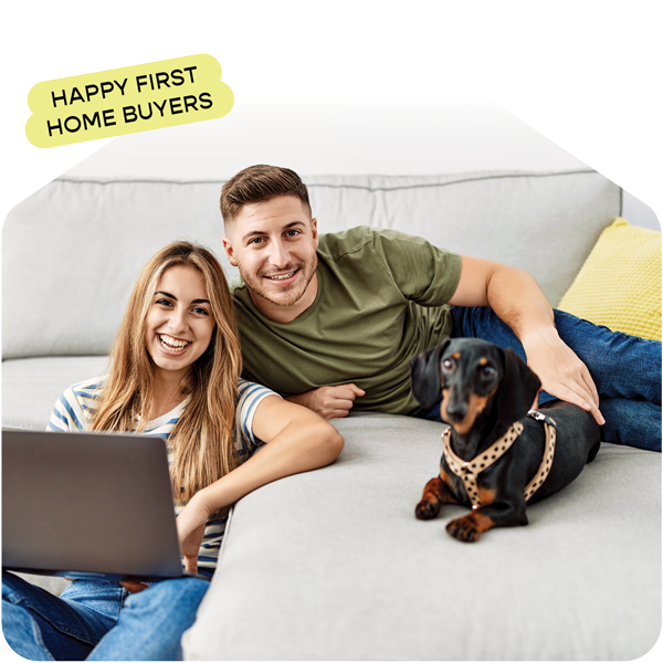 Happy home buyers on the couch with their dog