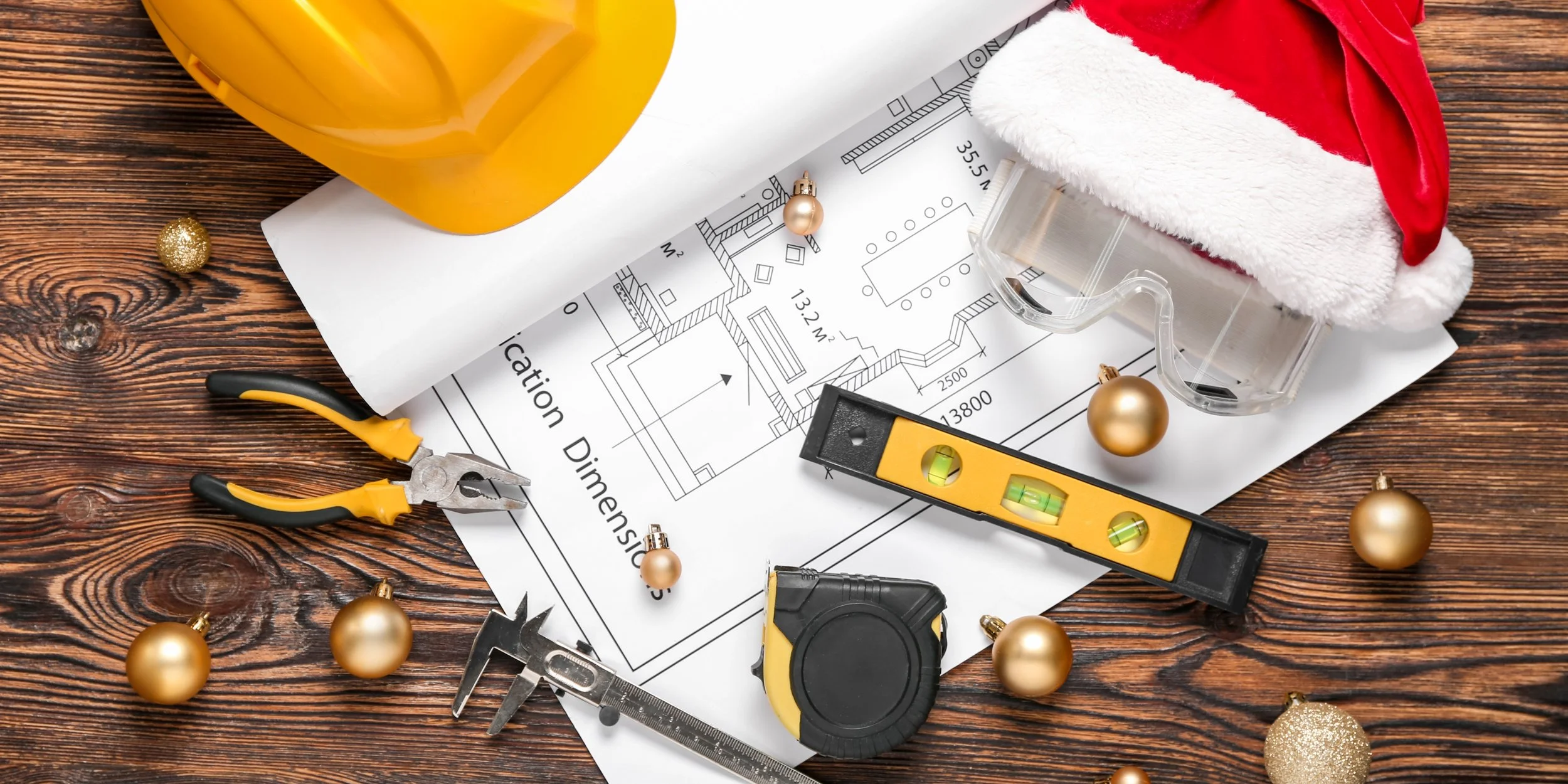 Why santa needs a toolbox this summer with a Santa hat, Christmas ornaments, and tools