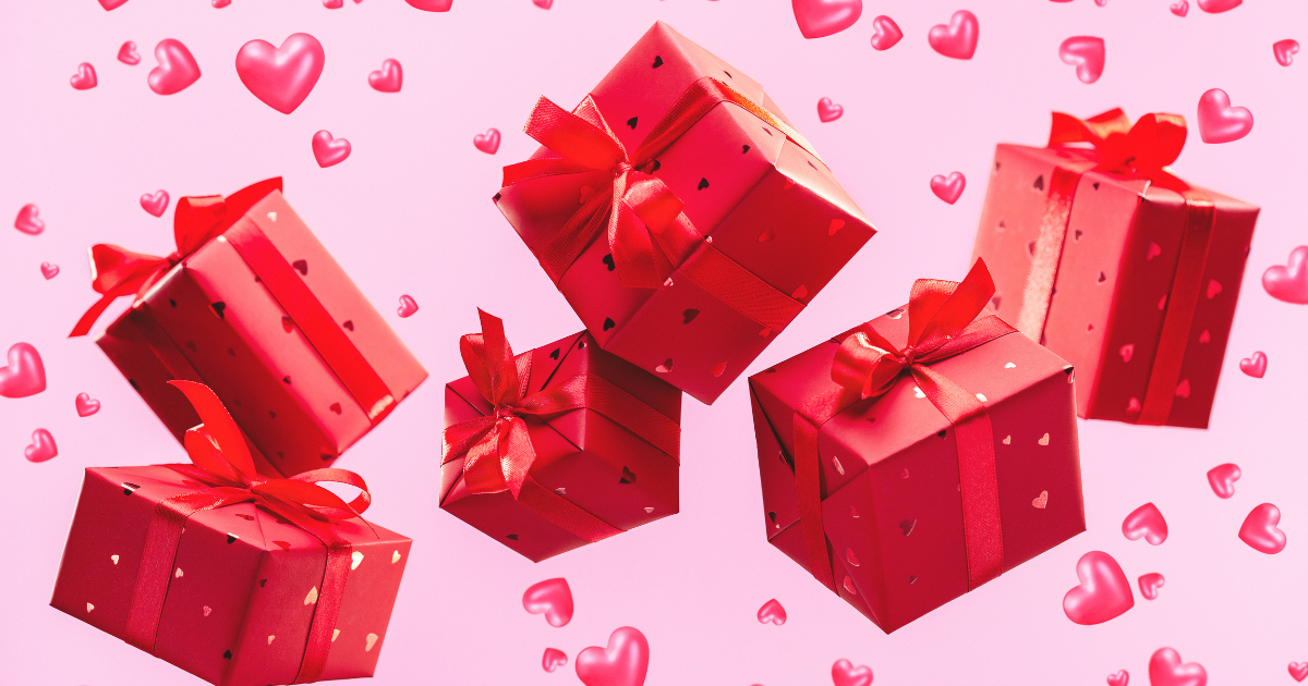 Red gift boxes floating in the hear on a pink background of hearts. The image is to accent the blog post titled our favorite valnetine's day gifts for tweens