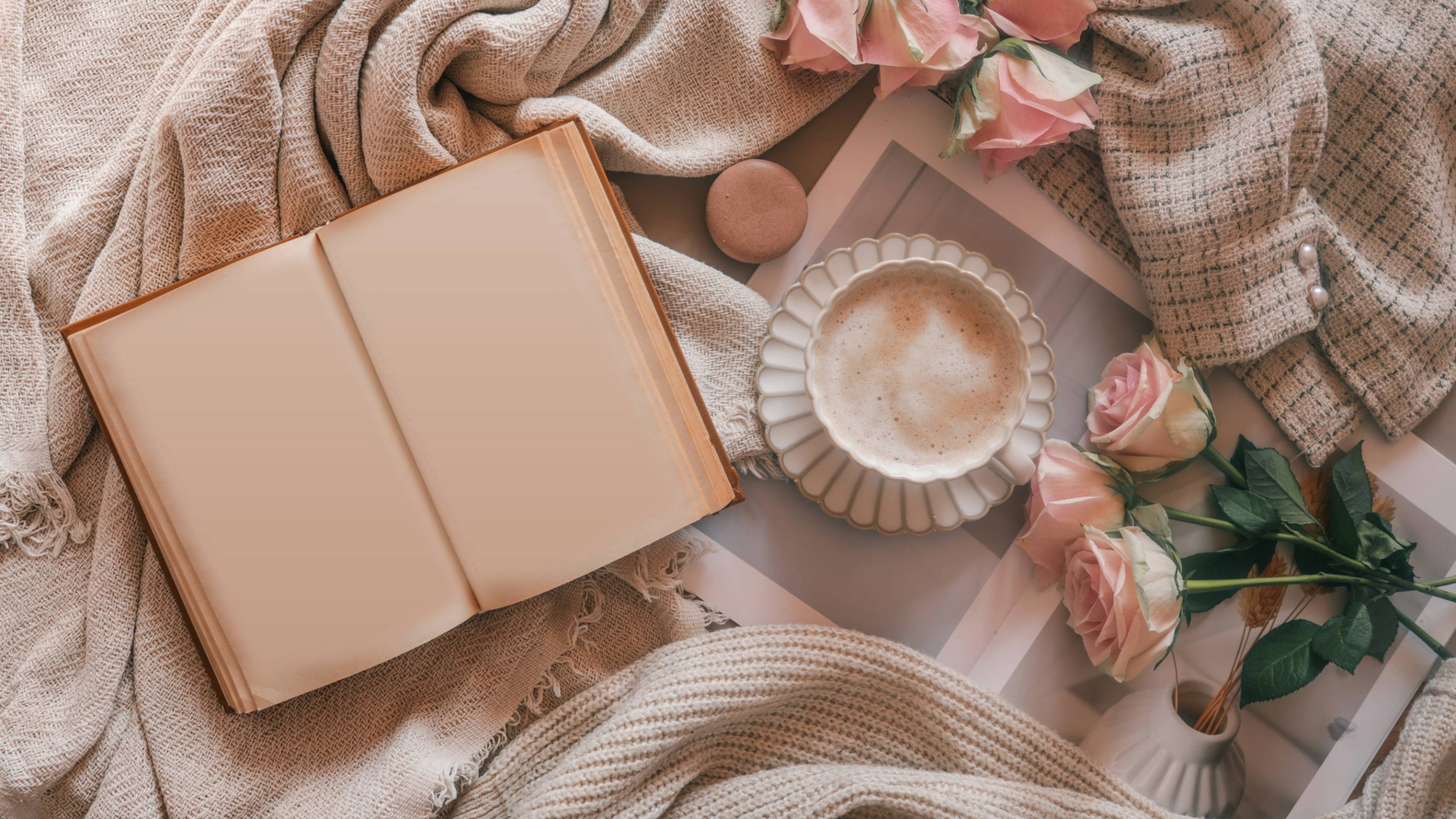 Editorial image of a book, coffee, macarons, and roses that are perfect gifts for moms who love to read