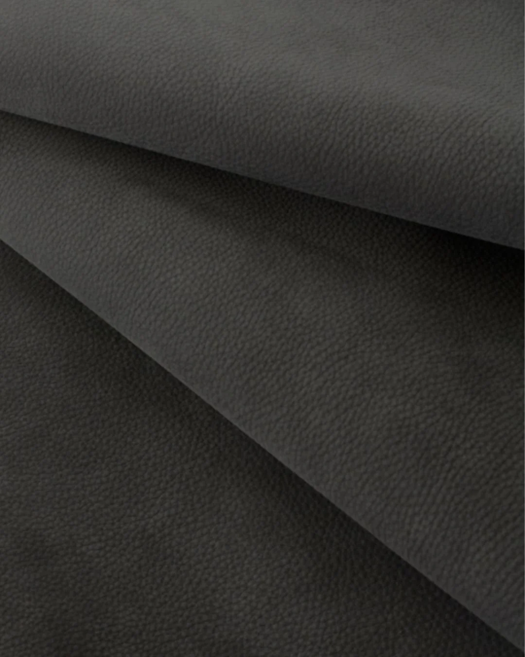 A deep, blue-black tone with a soft, shadowy quality.
Jagger Fade Away is a premium Italian nubuck, brushed to create subtle movement and depth of colour. Quietly luxurious, tactile &mdash; ideal for upholstery, panelling and refined interior applica