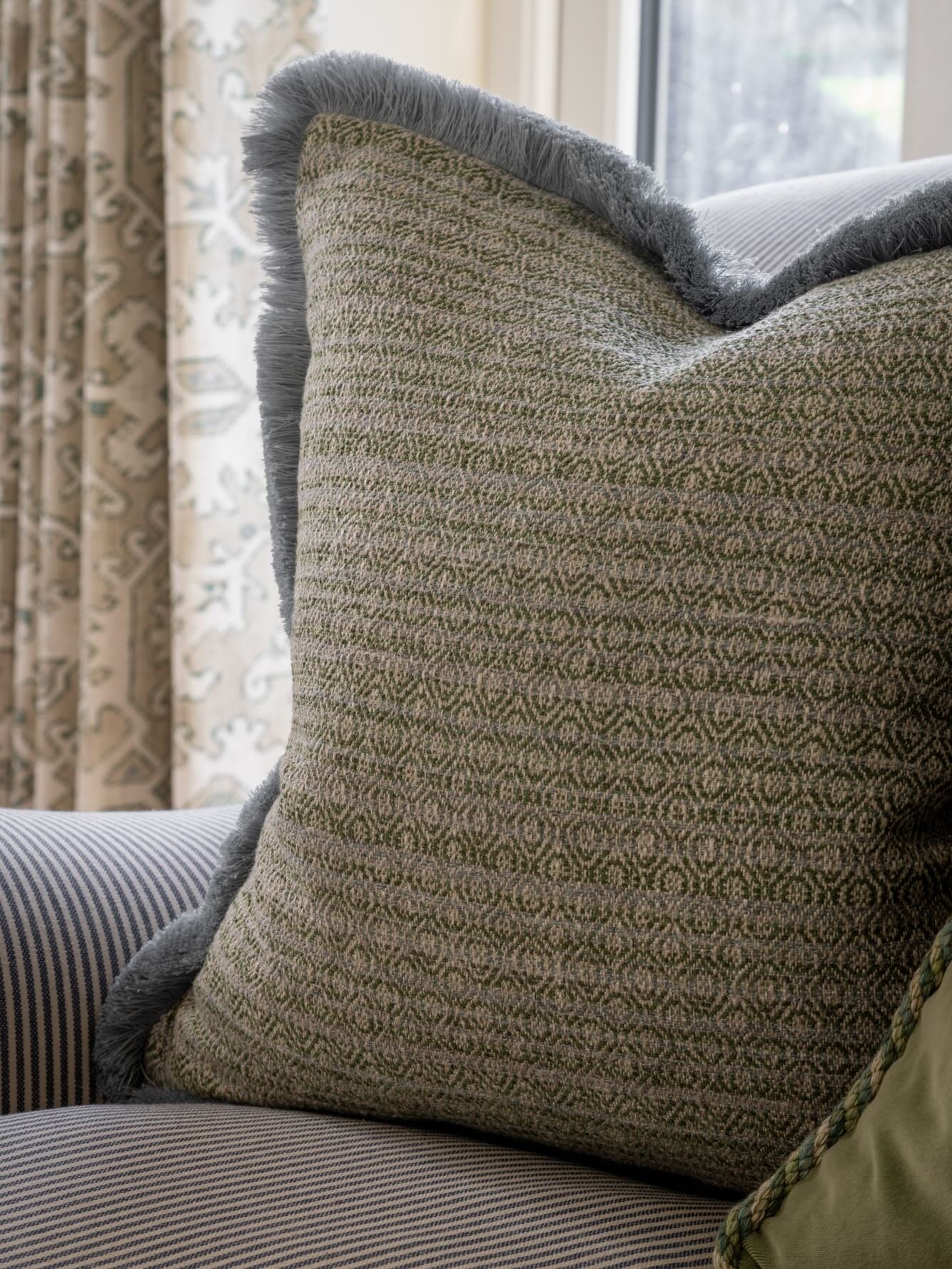 A closer look at the textures, tones &amp; thoughtful layering that bring warmth &amp; depth to this living space. From soft greens to timeless patterns 🍃🤍 @chriswakefield.photography