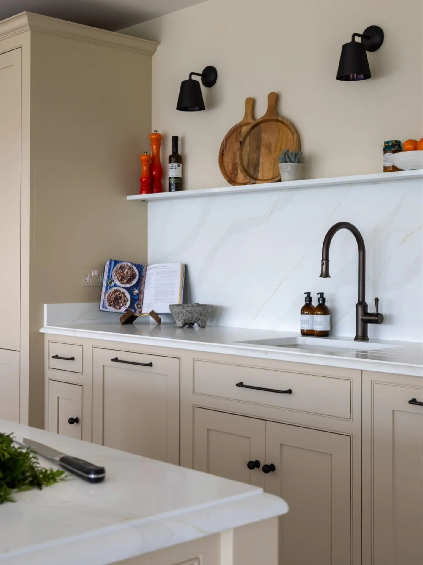 Creating a calm heart of the home. 🤍

The Calacatta Gold quartz provides the perfect canvas. We continued the stone up the backsplash &amp; into a corresponding shelf to create an elegant and seamless look. We finished this beautiful space with a cl
