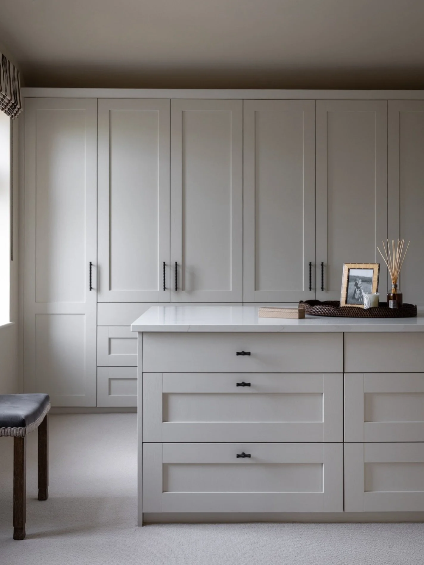 A closer look at this stunning principal dressing room! 🧥🤎

The central island is the main focal point with its crisp quartz top &amp; simple, curated styling. To keep everything feeling effortless &amp; calm, we designed bespoke cabinetry to provi