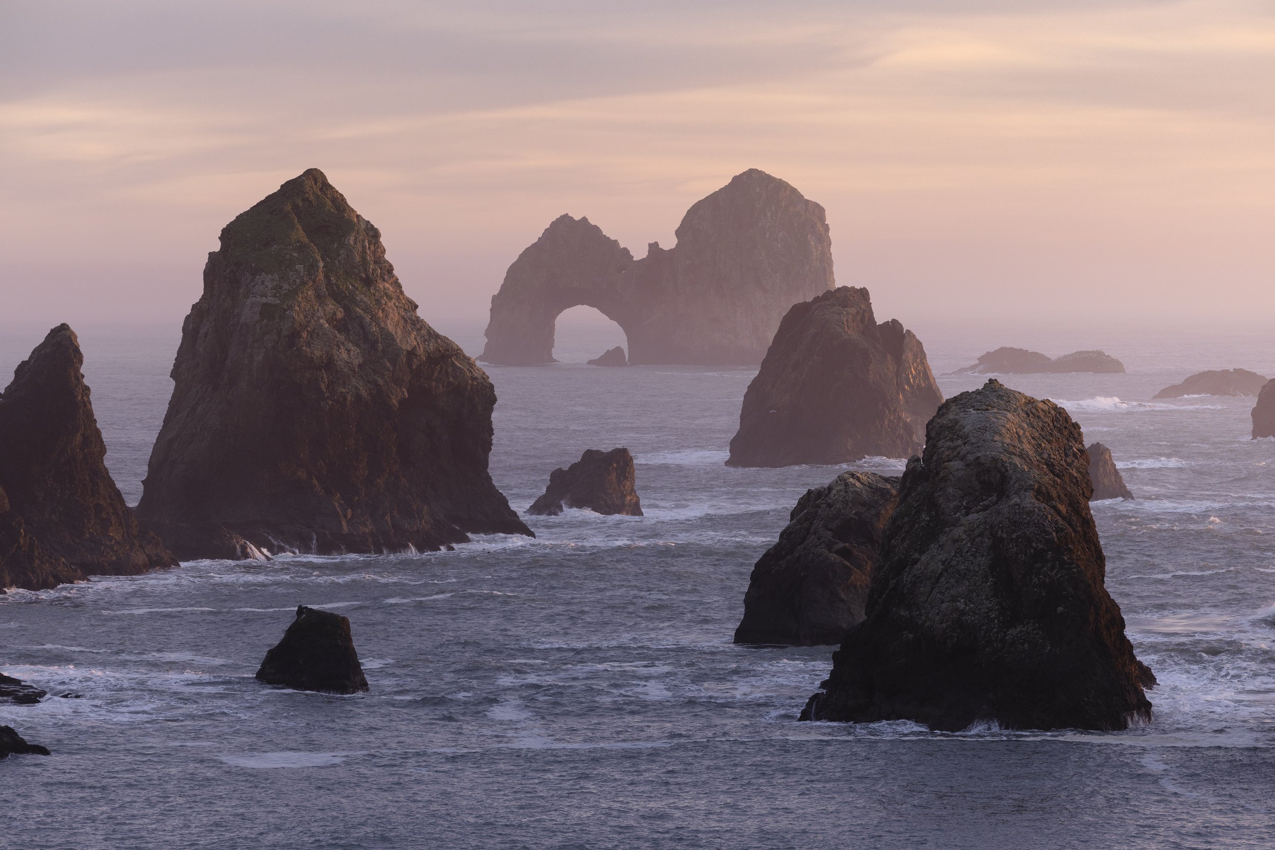 A colorful sunset at Crook Point along the southern Oregon coast.