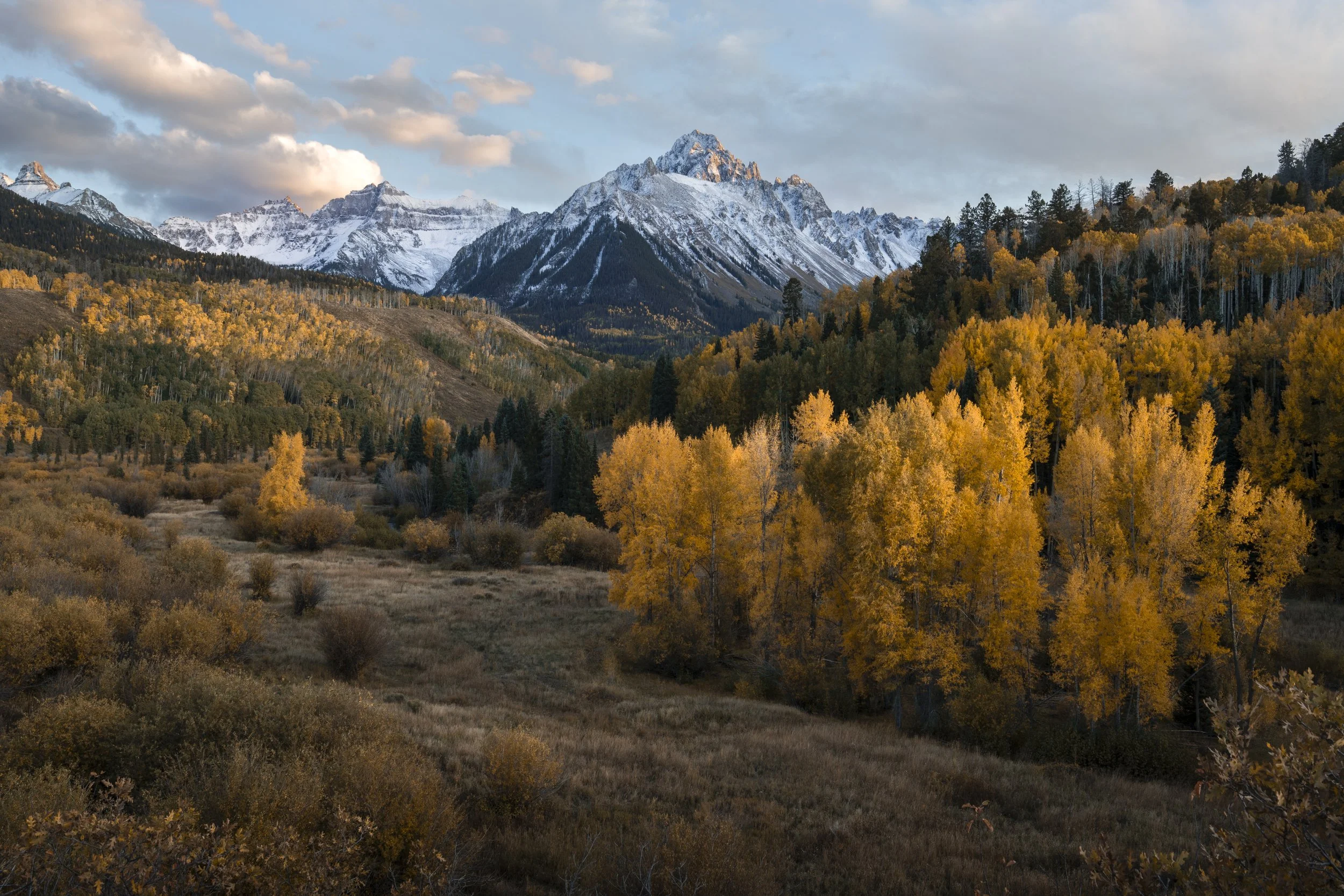 Early October foliage surrounds Mt. Sneffles in the San Juan Mountains of southwestern Colorado.