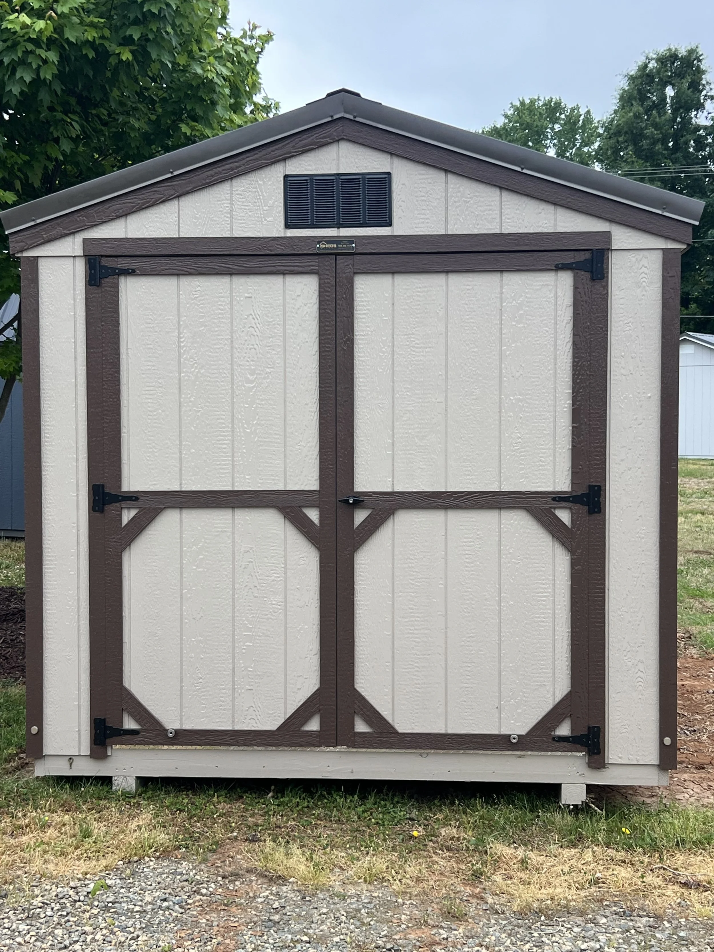 Clay and Burnished Slate storage shed with double doors.