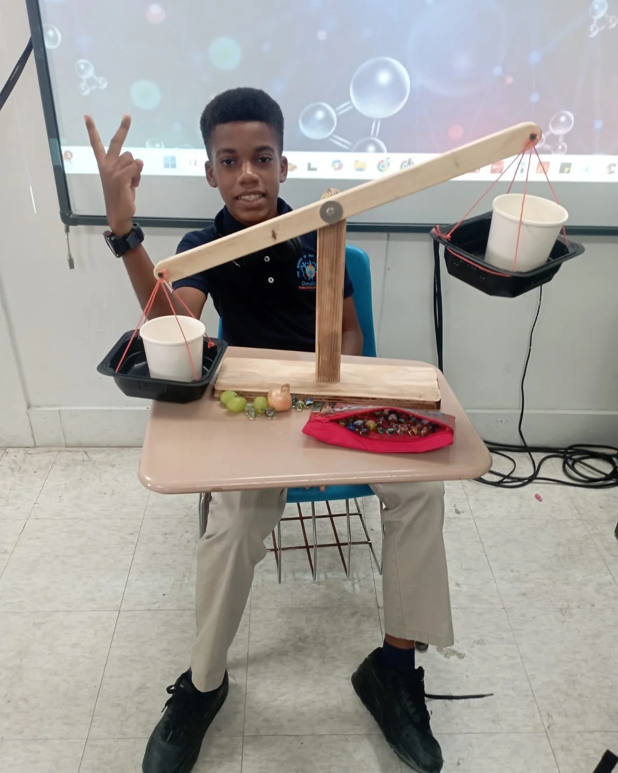 As part of our unit on Measuring Mass (CCSLC Integrated Science curriculum) Omololu International School Grade 7 students engaged in a hands-on investigation where they researched and constructed balance scales using household materials. 

They then 