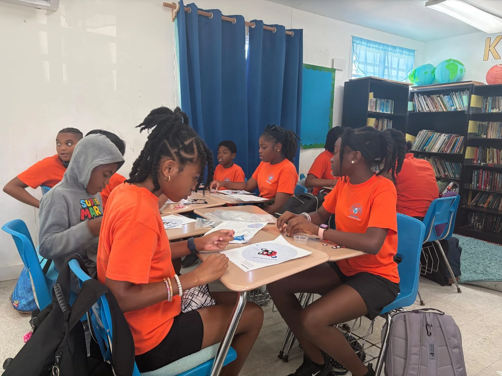 What does an atom actually look like?

Our Grade 7 Science students explored atomic structure in a hands-on way using the Science Take-Out Kits.

Using colored chips to represent protons, neutrons, and electrons, they were able to build their own mod