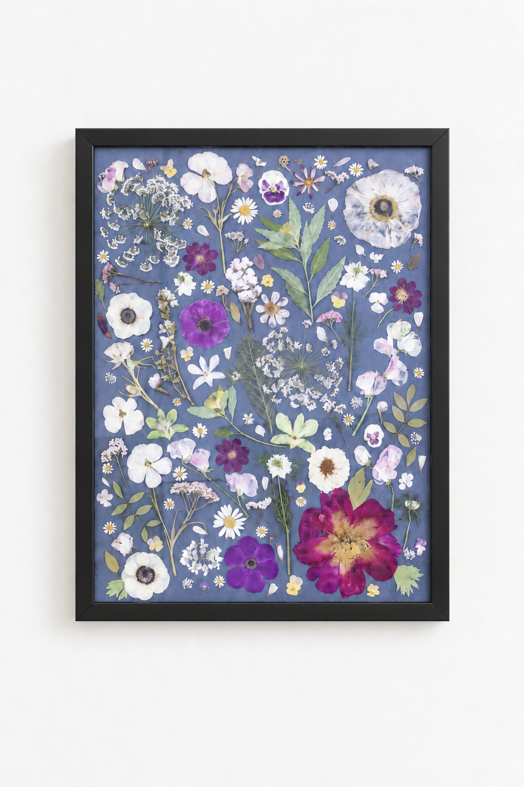 Blue floral artwork in matte black frame.png