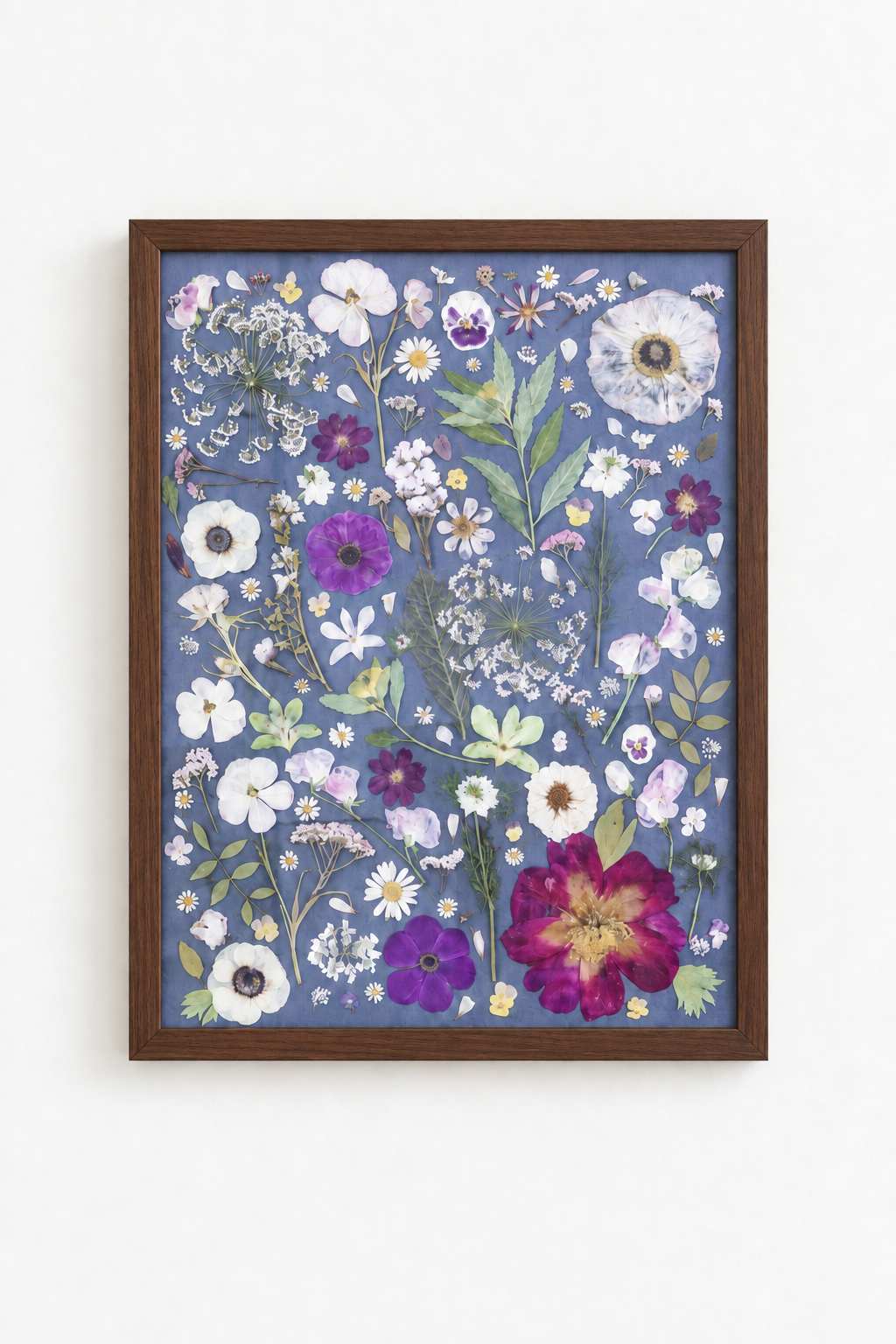 Blue floral artwork in a walnut frame.png