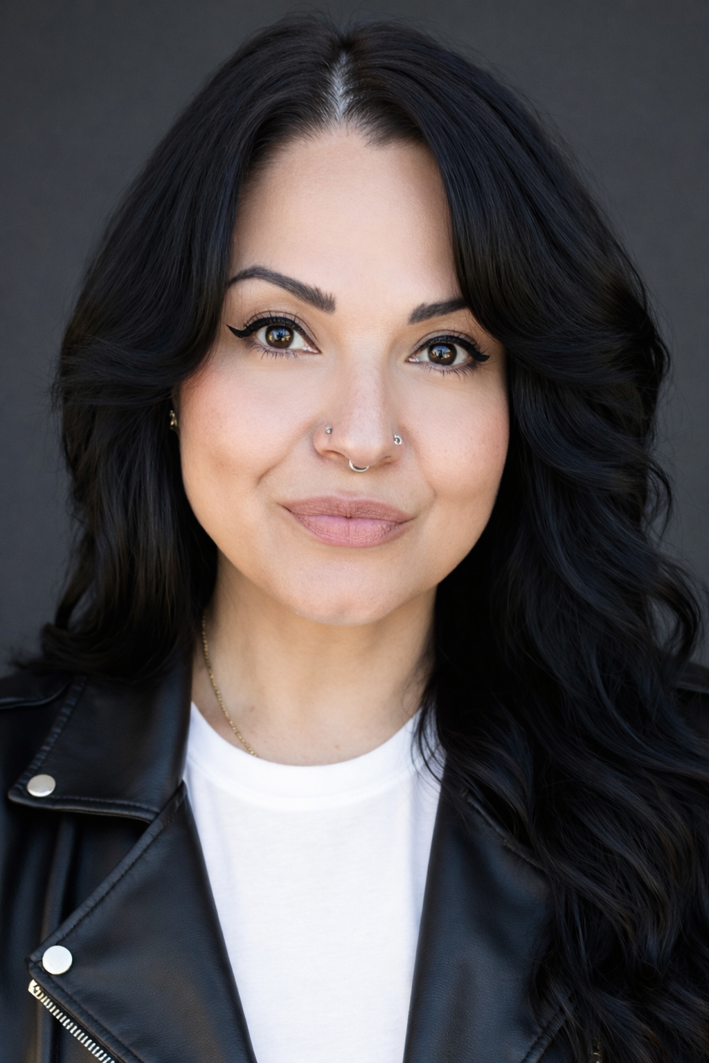 Ingrid's headshot wearing a leather jacket