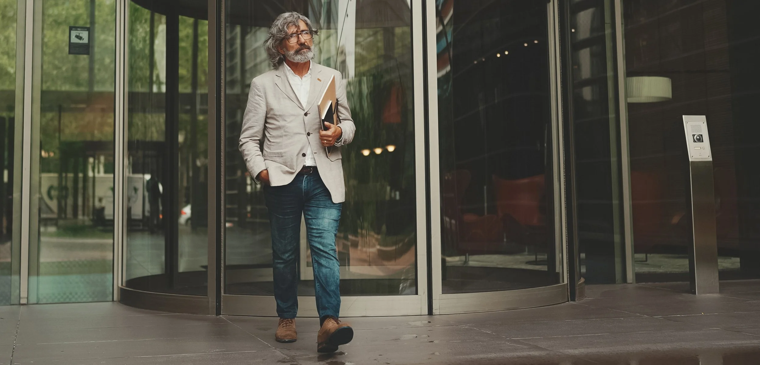 A man walks out of an office building. If you're a Google employee age 50 or older, significant changes are coming to your 401(k) catch-up contributions in 2026.