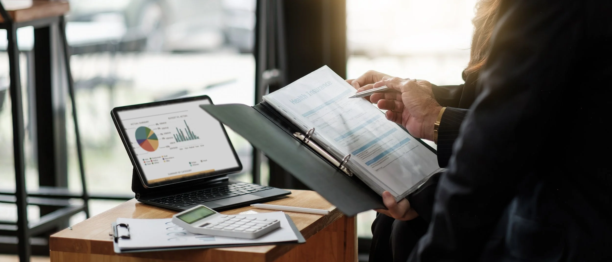 Binder, laptop and calculator. Oracle compensation and benefits guide: RSUs, ESPP, 401(k), mega backdoor Roth, and health coverage—what tech employees need to know before retiring.