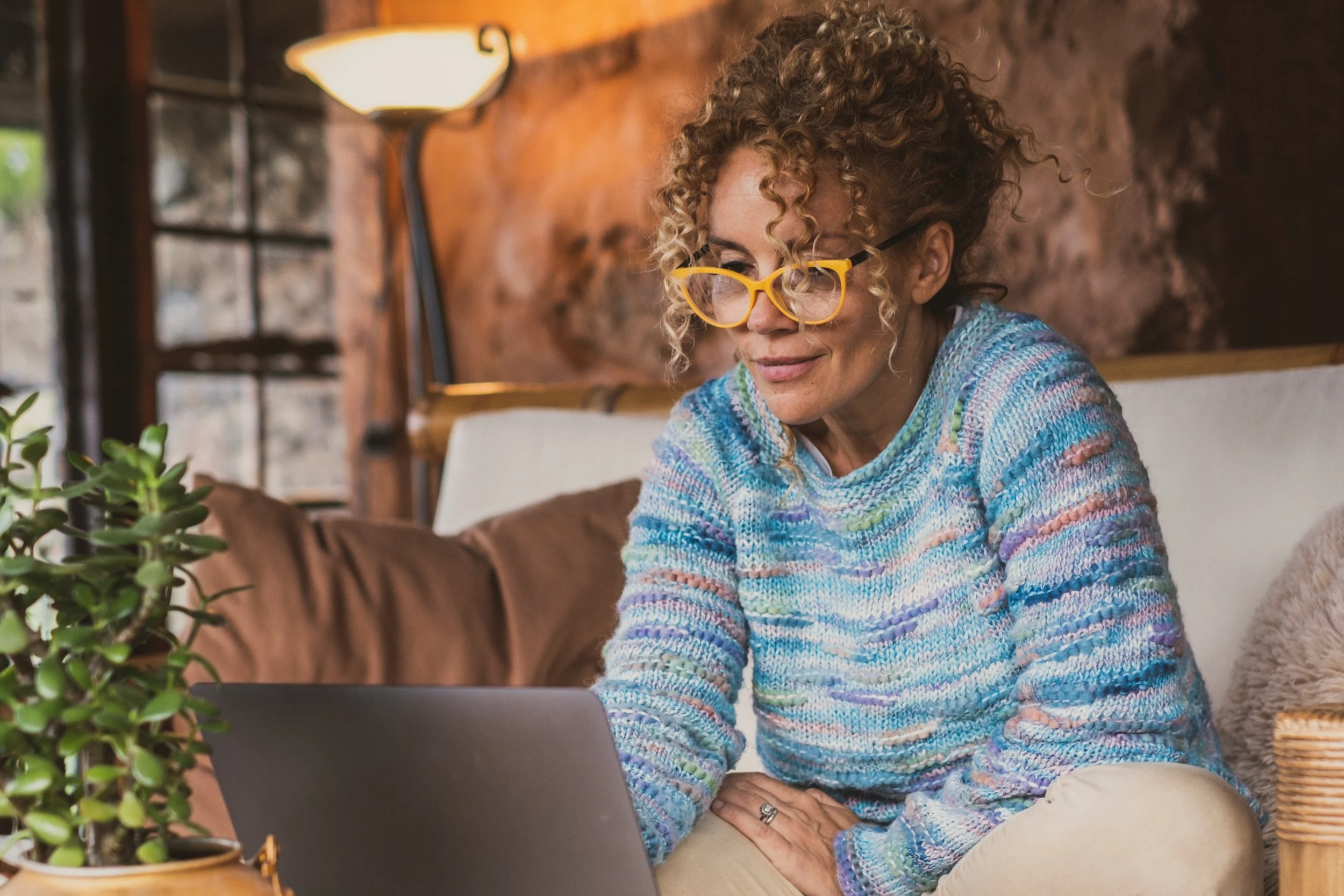 Woman on laptop. OpenAI employees: learn how to handle equity, taxes, and RSUs before the IPO. Explore strategies to protect your wealth and reduce your tax bill.