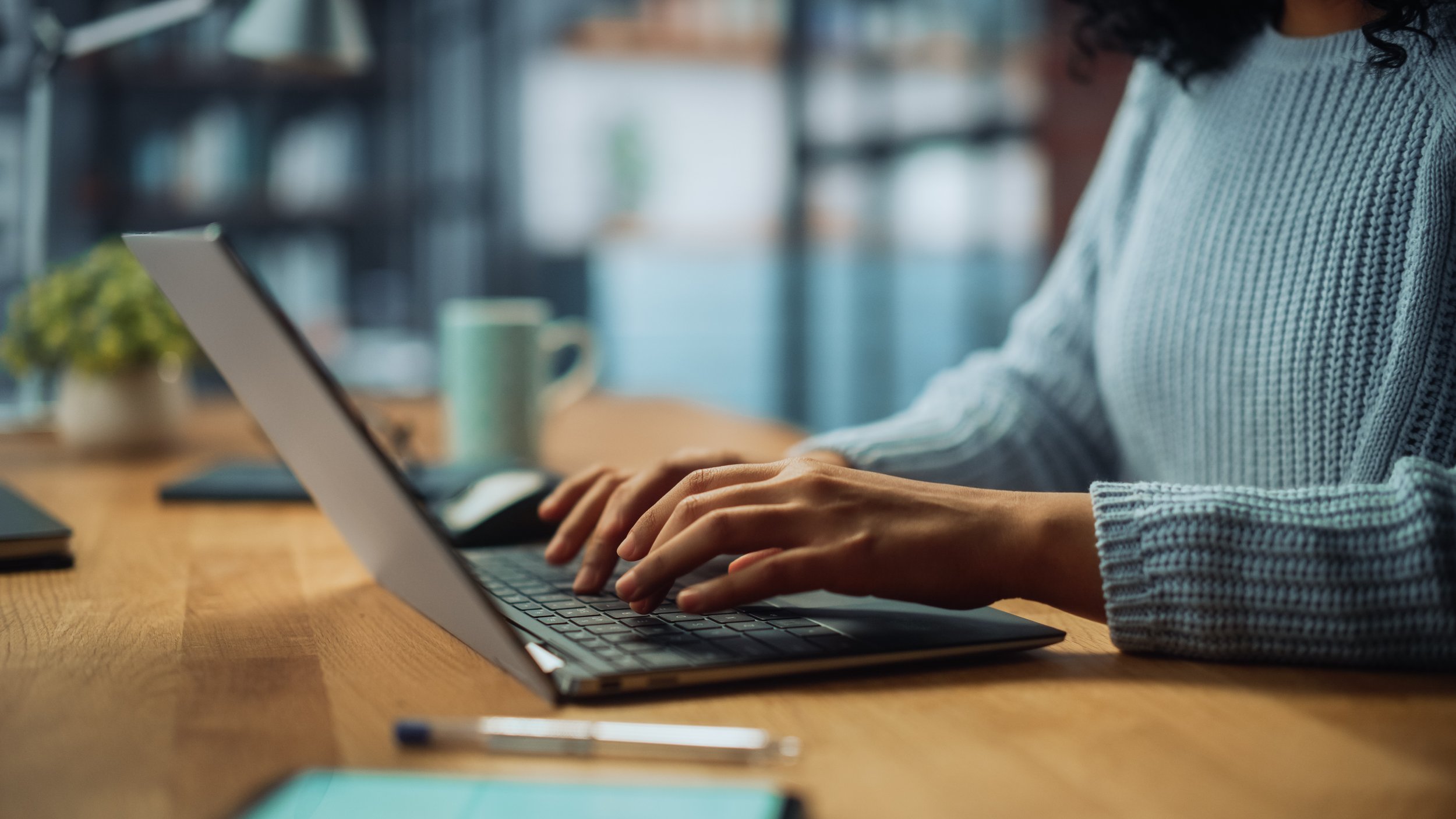 Woman typing on laptop at desk. Cisco compensation and benefits include a 401(k) with immediate vesting, mega backdoor Roth, RSUs, ESPP, and more. Learn how to maximize each benefit and retire with more.