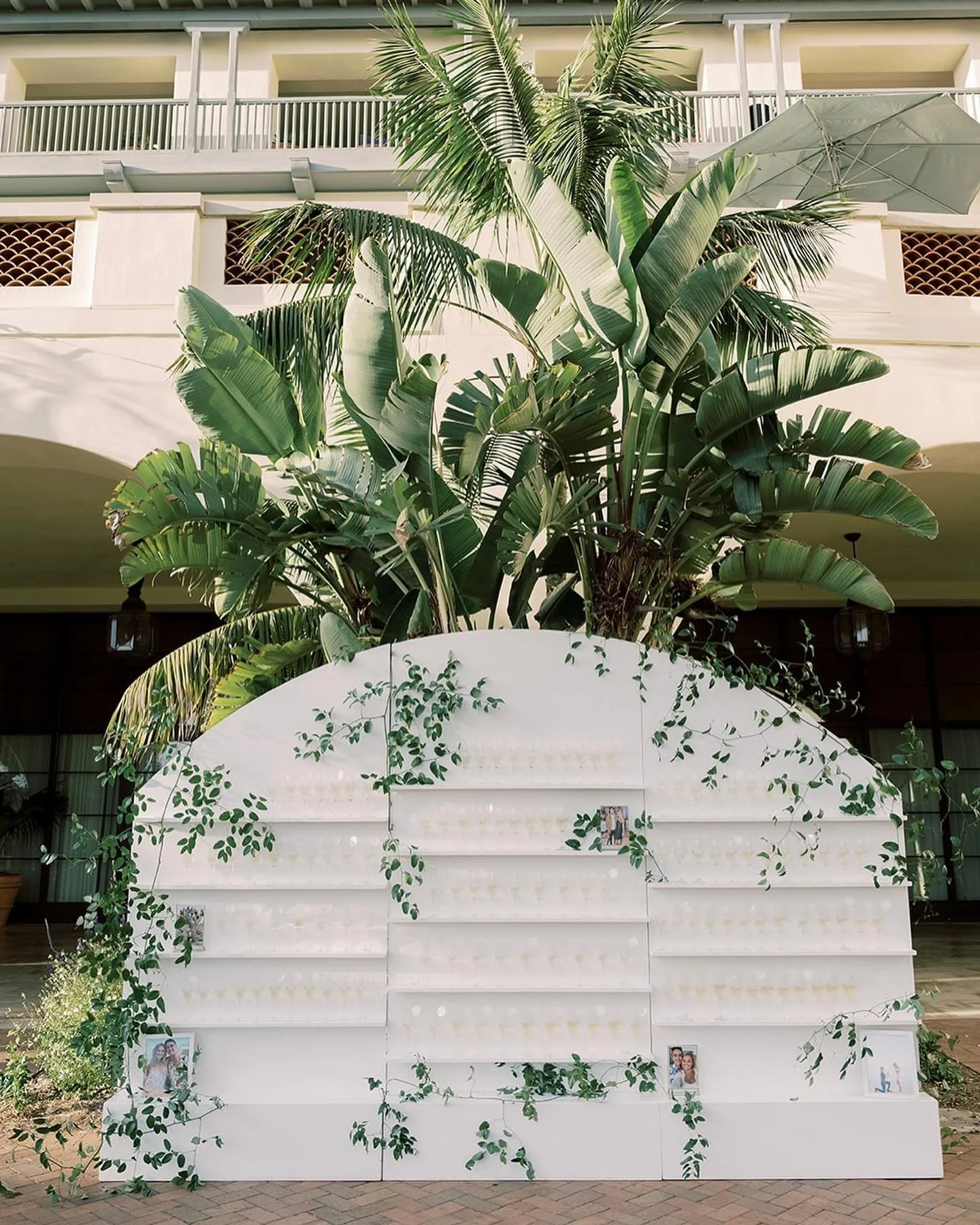 A timeless champagne wall. One of my most favorite ways to display your escort cards. Your guests are greeted into cocktail hour by a glistening gold wall of champagne flutes, where they find their name card sitting on the glass. The perfect way to s