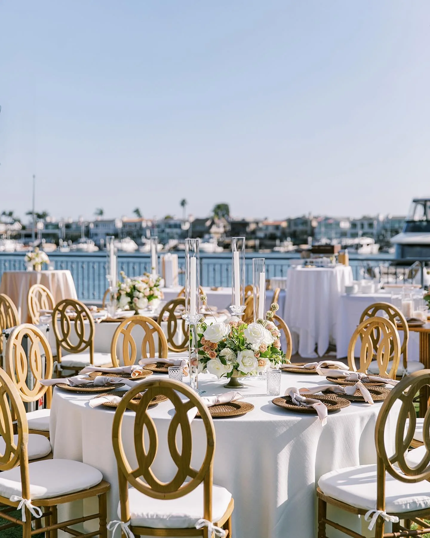 A waterfront oasis at @balboabayresort . Designing this gorgeous 50th anniversary for our corporate client was so much fun. They wanted something light for summer (hence the woods and neutrals), while incorporating gold from their new brand color (wh