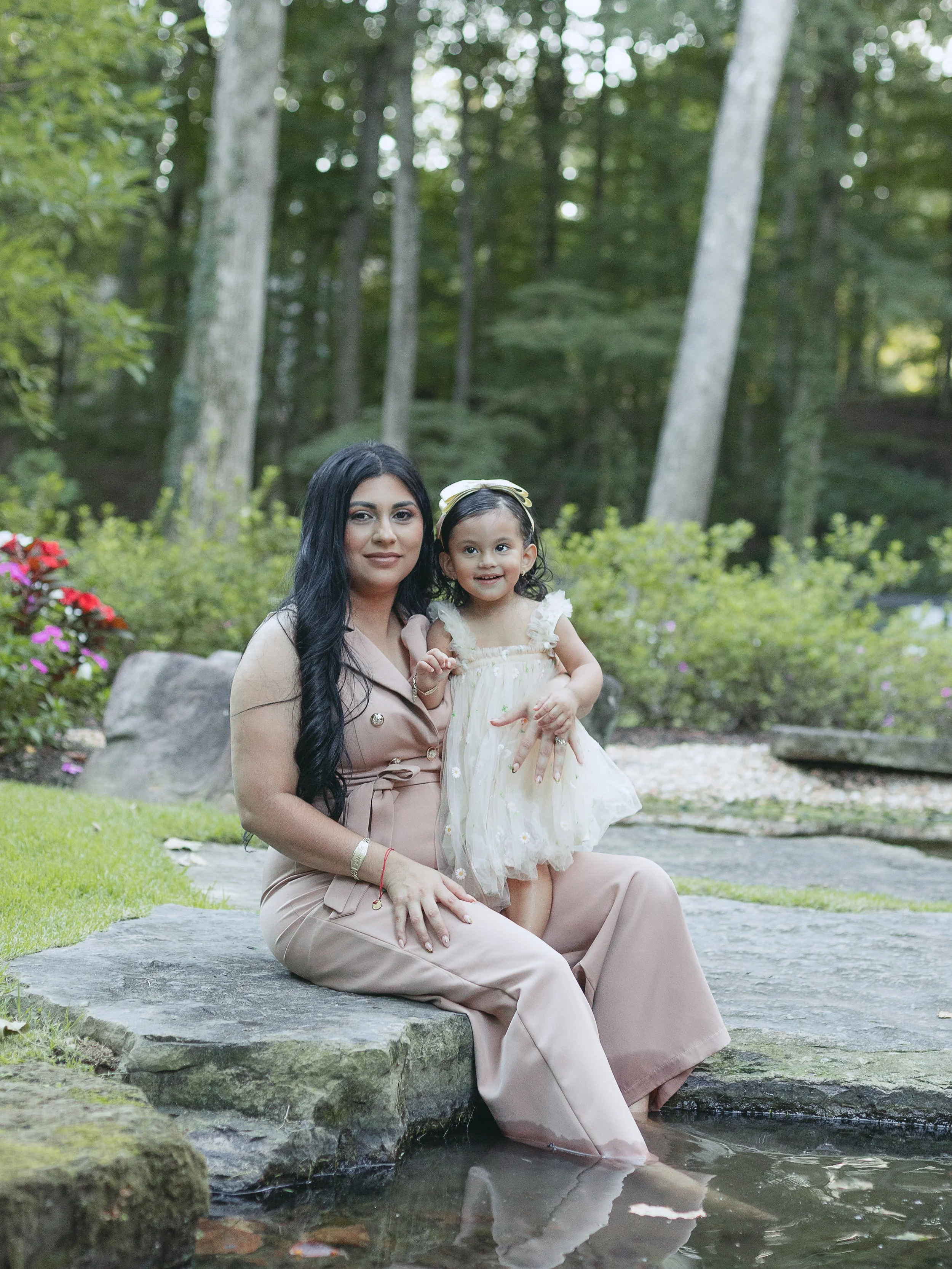 Mother and daughter smiling together during a portrait session
