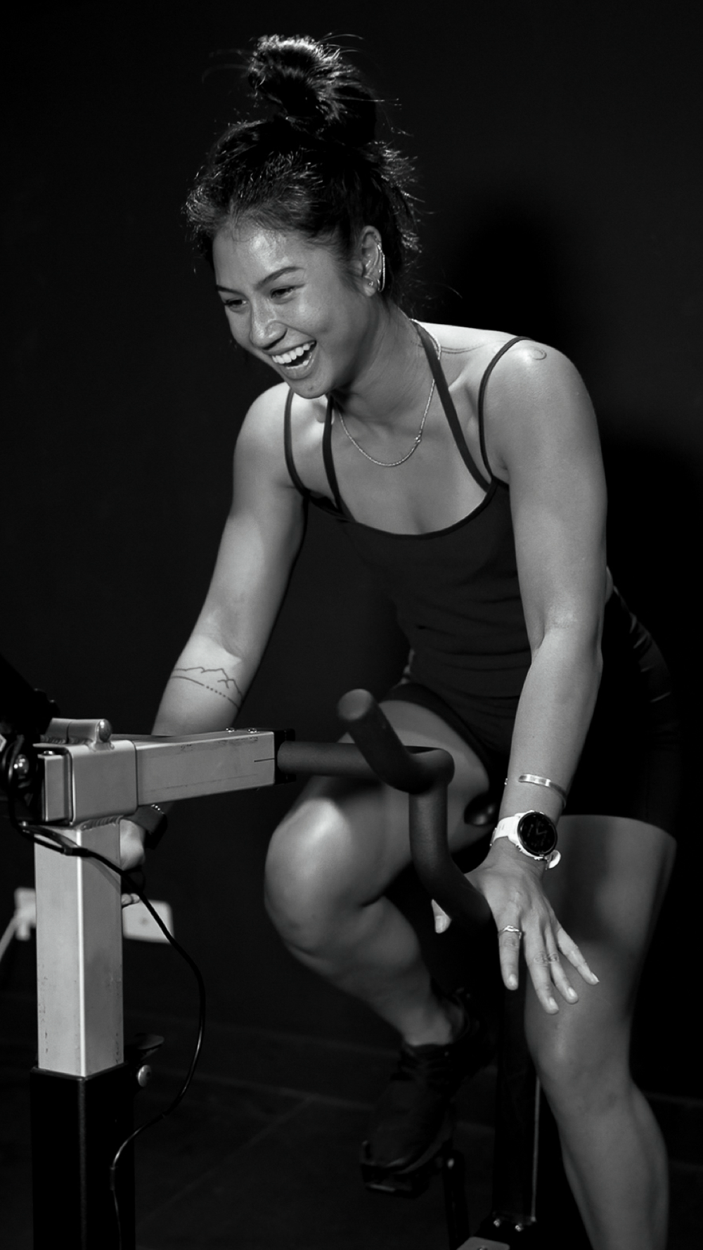 ENGINE. class: member smiling on a bike