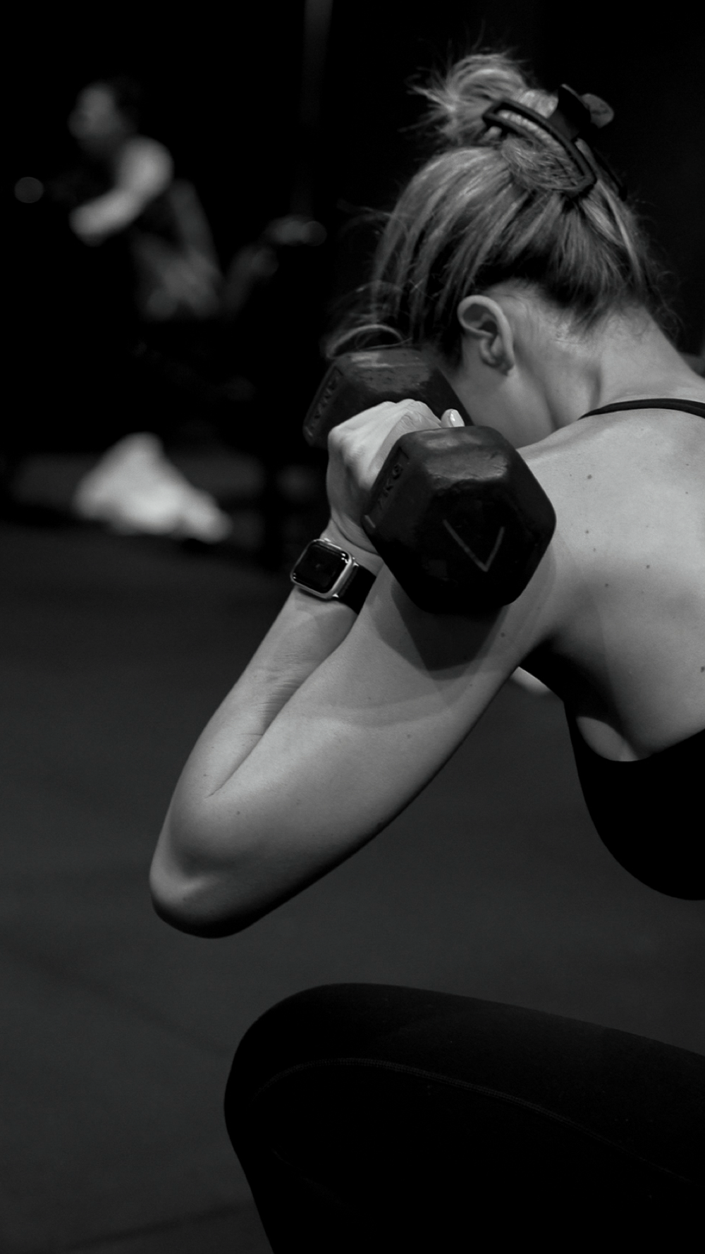 BASE. class: member working with a dumbbell
