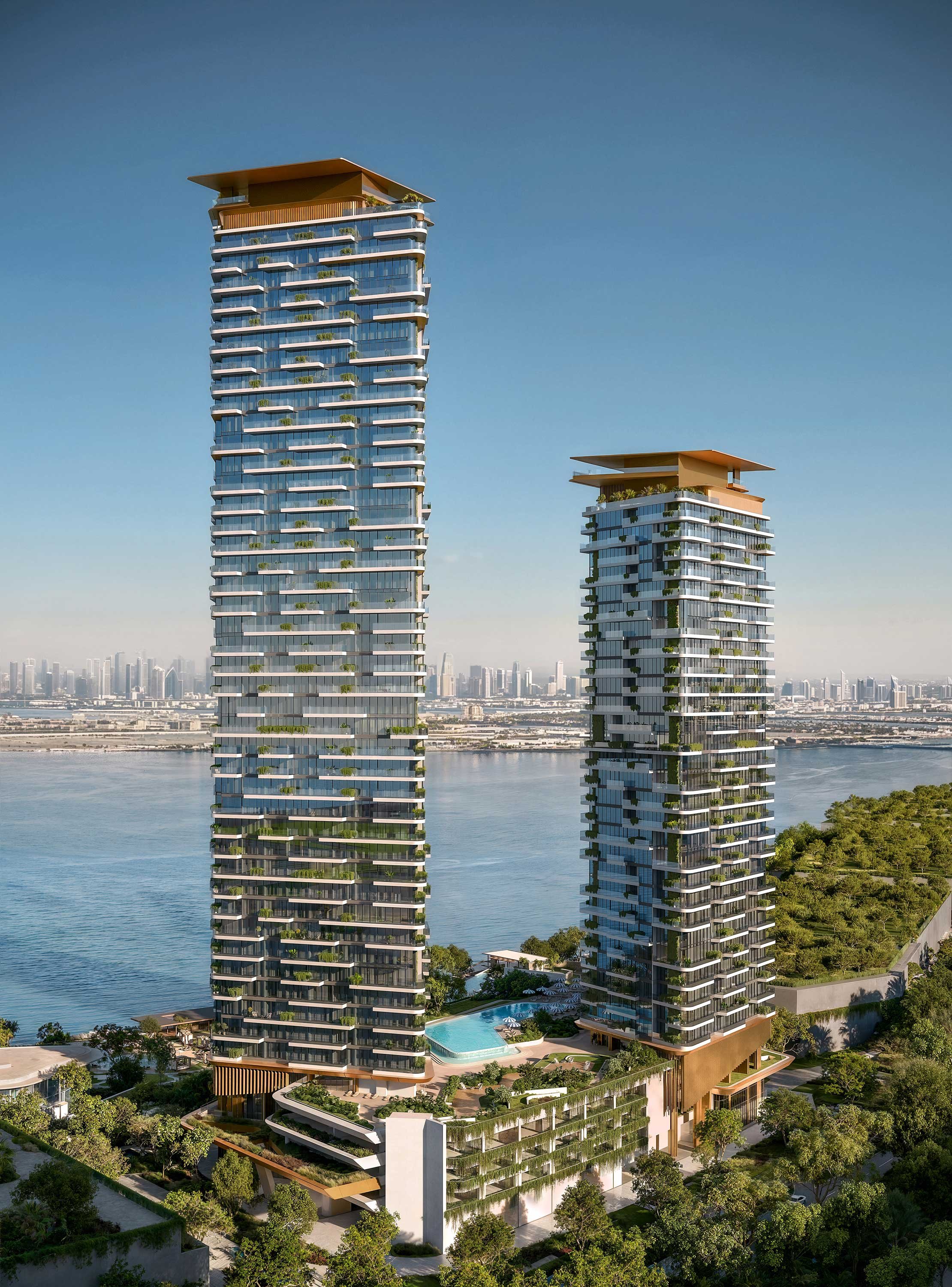 Two modern high-rise buildings with glass facades, surrounded by greenery and a swimming pool, with a city skyline in the background.  Beyond Properties. Dubai Real Estate Marketing.