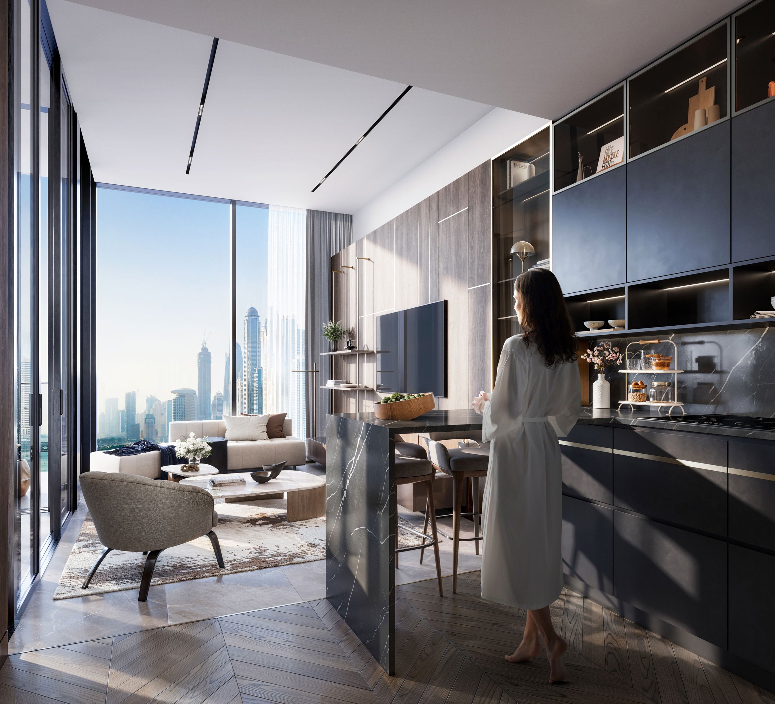 Modern high-rise apartment living room with large floor-to-ceiling windows showing a city skyline, a beige sofa with pillows, a white coffee table, a gray armchair, and a rug. The kitchen area features black cabinets, a marble countertop, and a woman