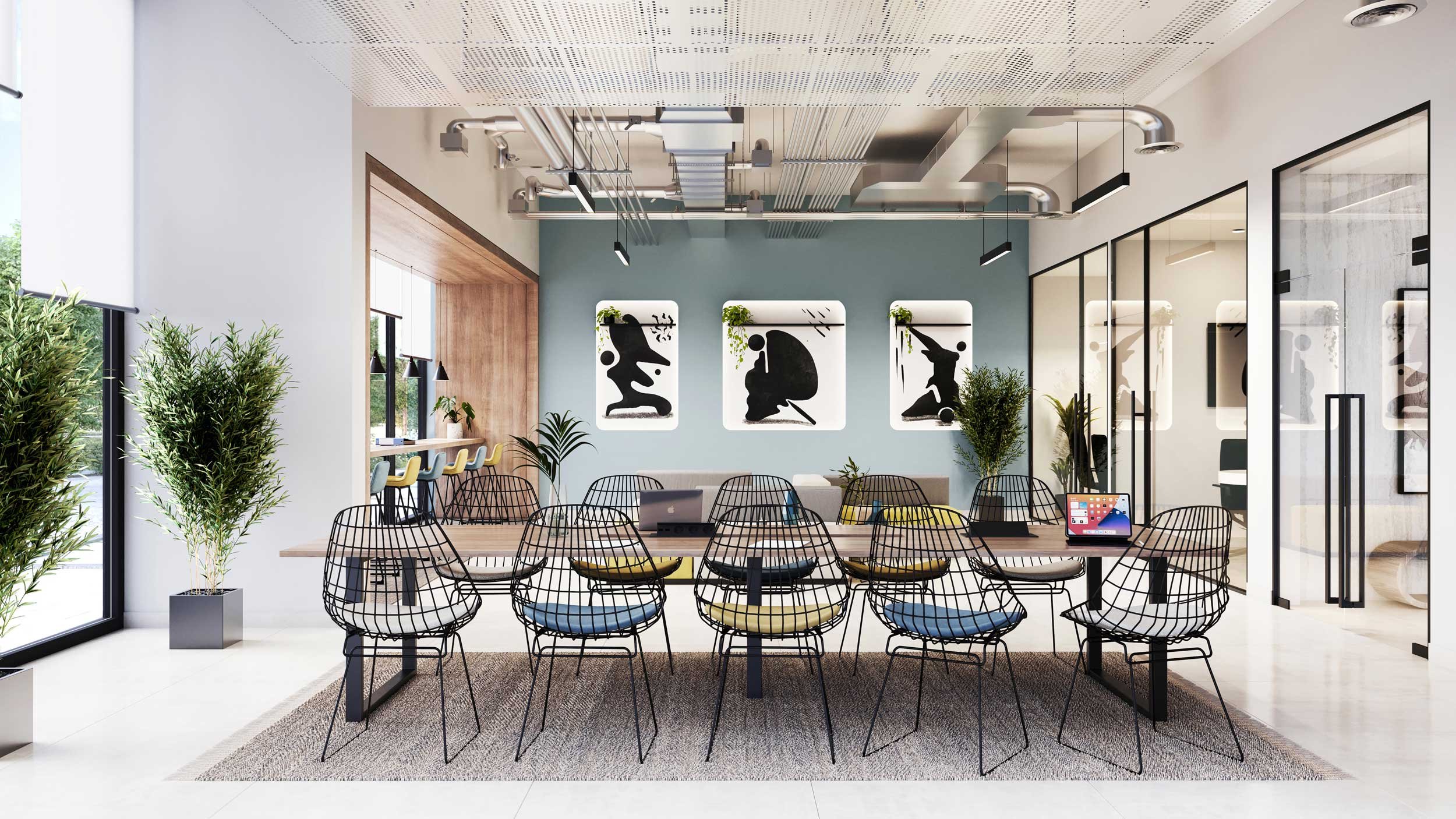 Modern coworking space with a large wooden table surrounded by wireframe chairs, potted plants, abstract art on the wall, and a glass wall with doors.
