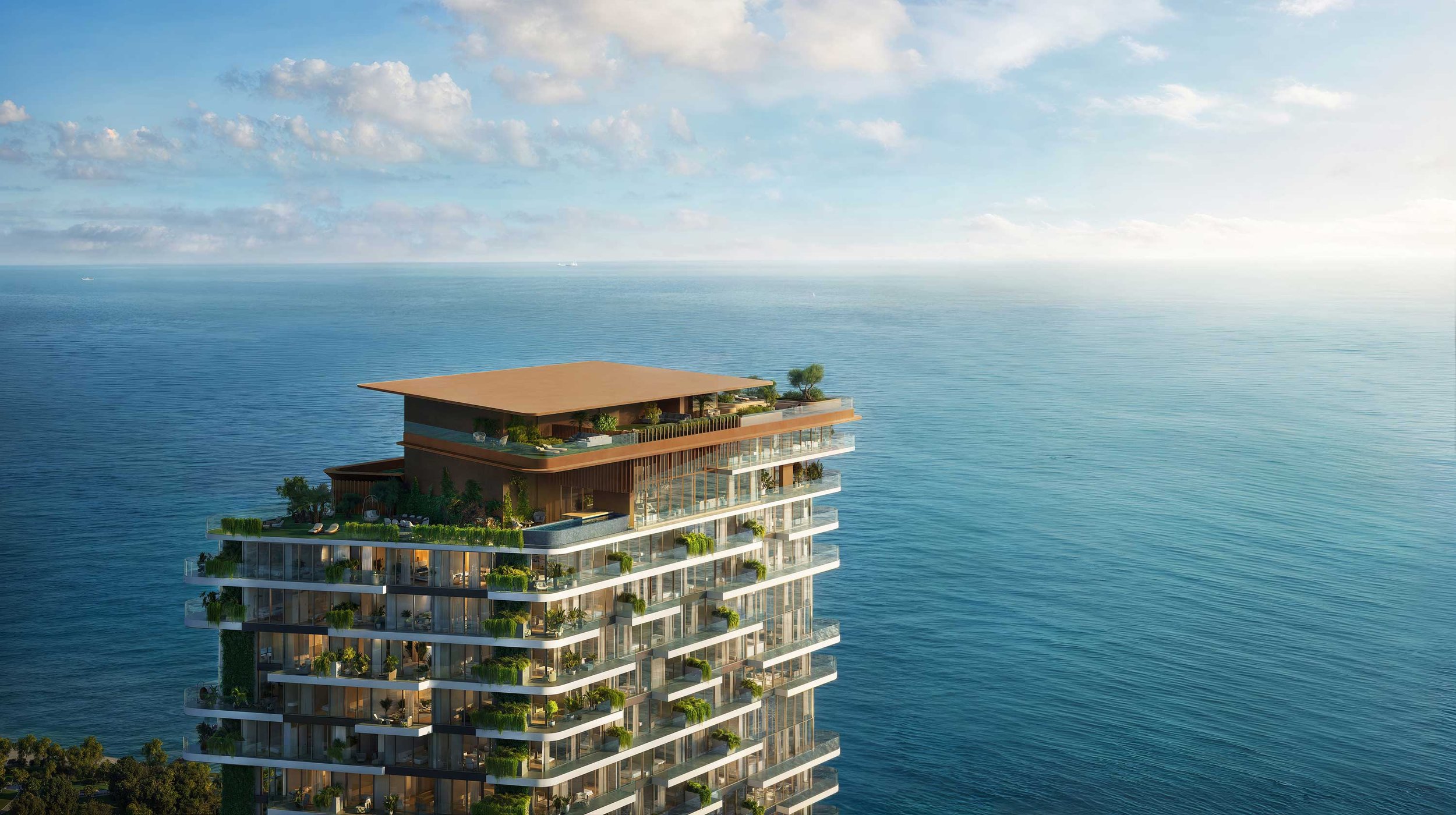 A modern high-rise building with glass balconies and greenery, located on the edge of the ocean under a partly cloudy sky.  Beyond Properties. Dubai Real Estate Marketing.