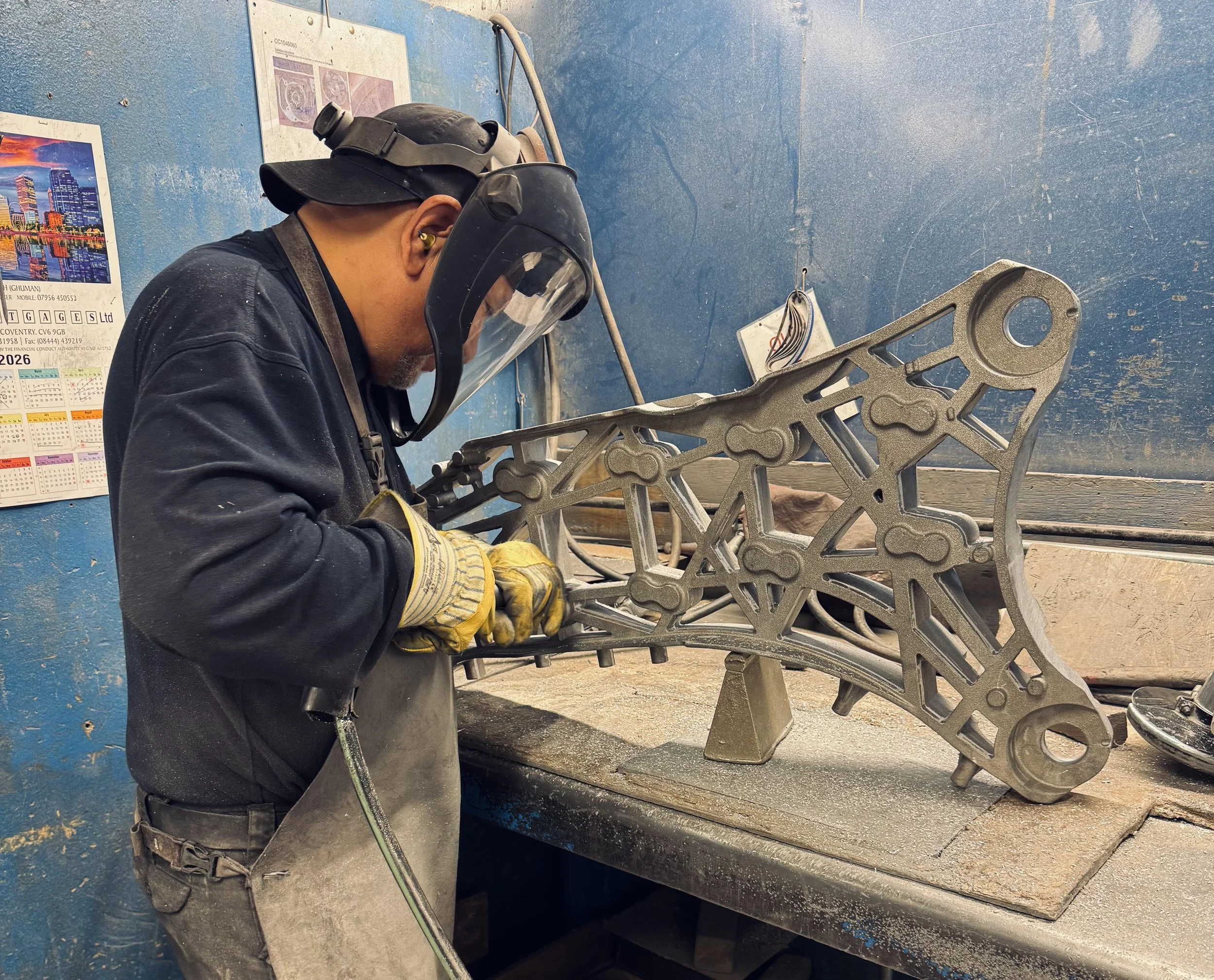 A worker working on a casting.