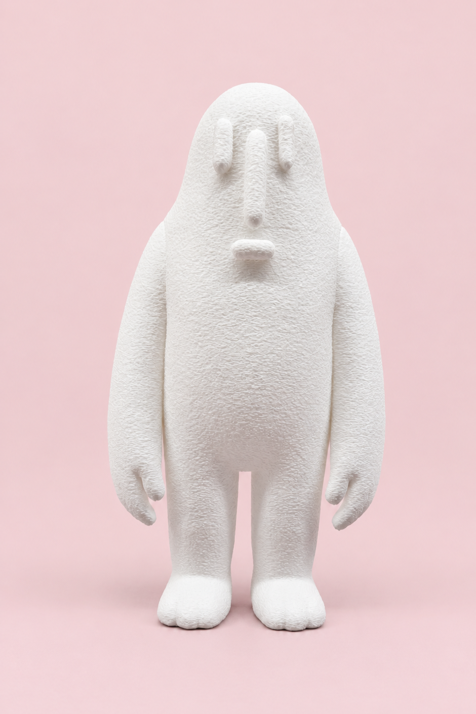 White HYNY figure against a pastel pink background
