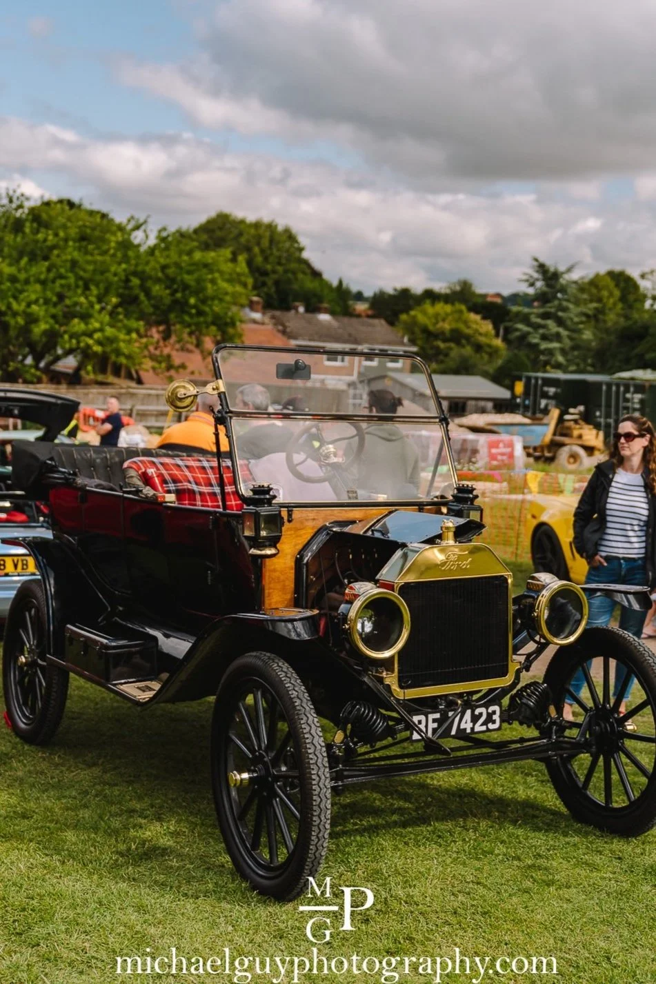 Vintage cars with visitors at a Daily Driven Events show