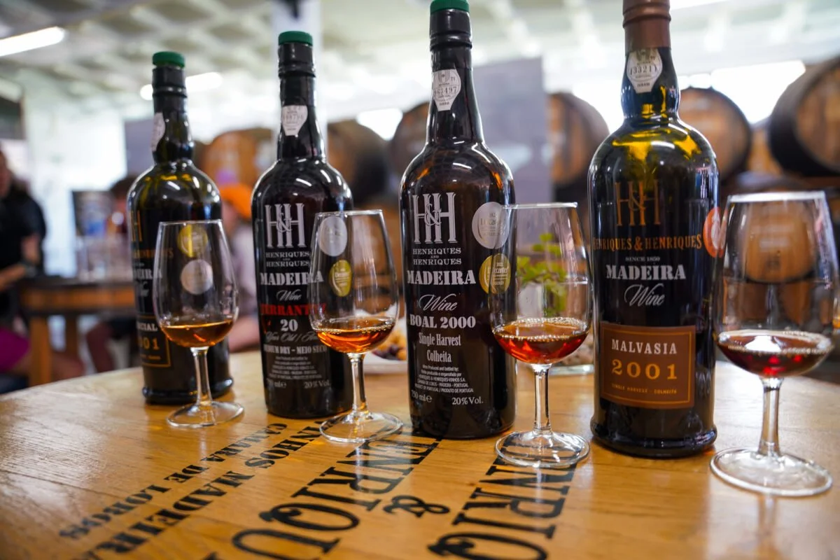 Glasses of fortified Madeira wine being tasted
