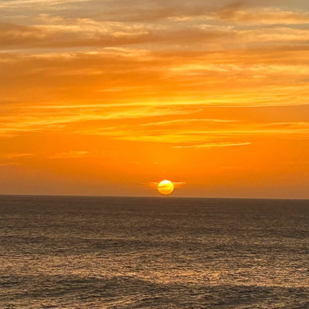 The sun setting into the open Atlantic
