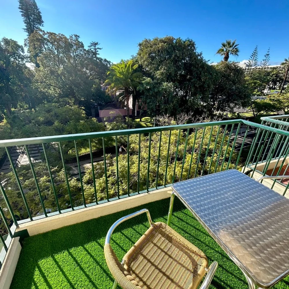 Looking down from the balcony into the gardens of the park