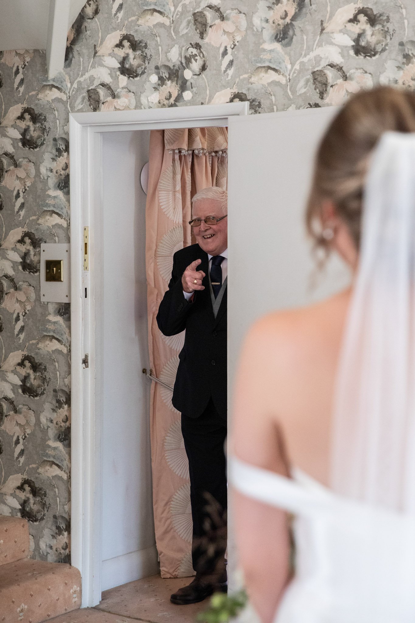 Father seeing bride for the first time, first look.