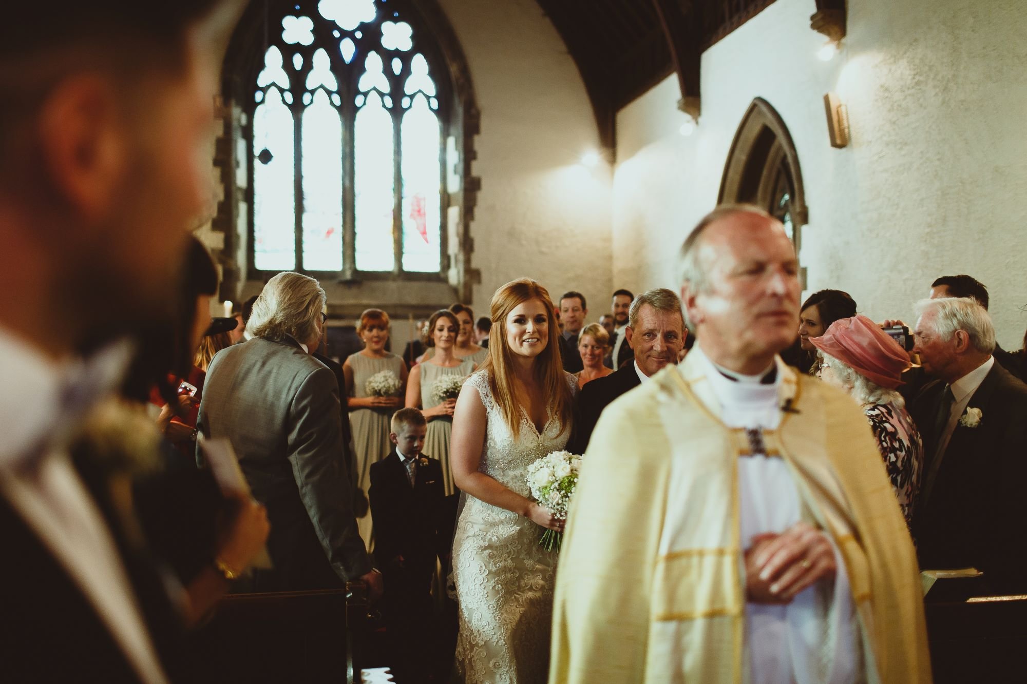 Bride walking into church