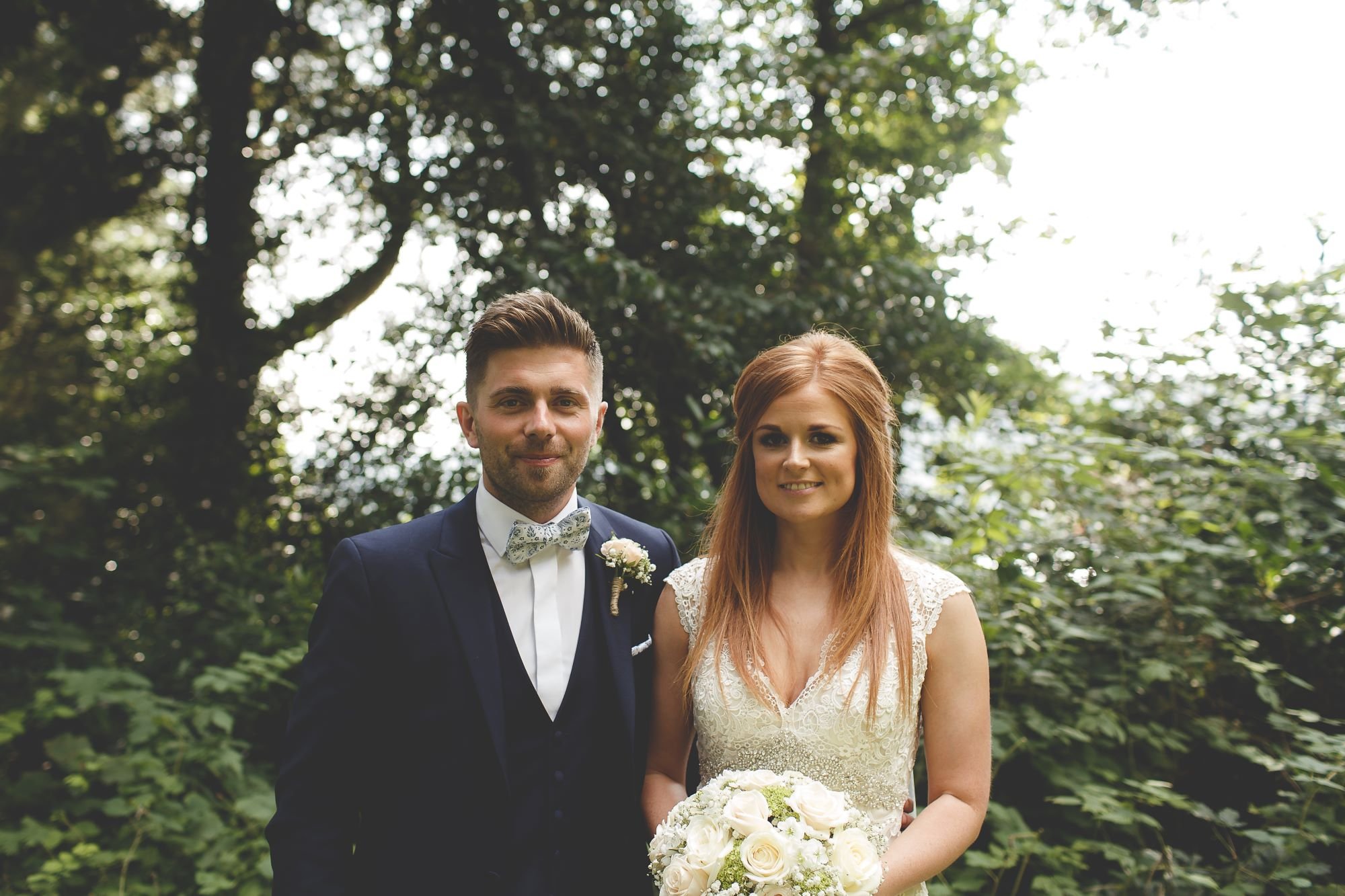 Newly married couple smiling during wedding photos