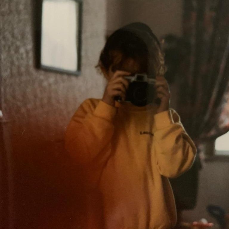 Young Kayleigh Lee, taking a photo