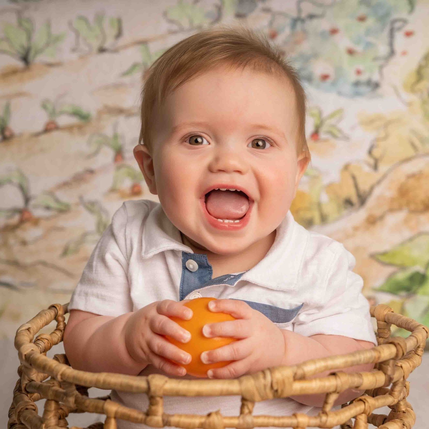 happy baby with a ball