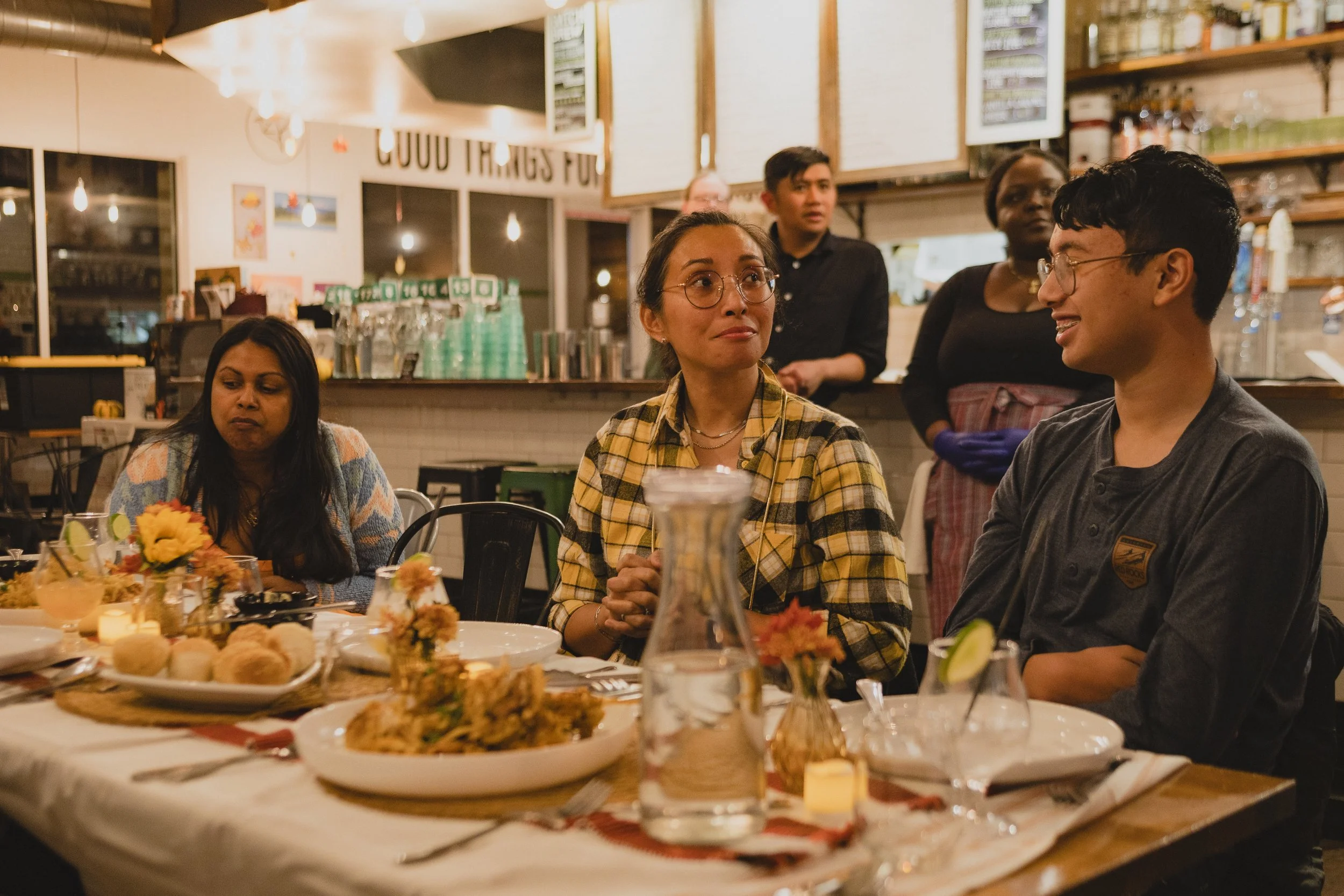 People laughing and enjoying their meal